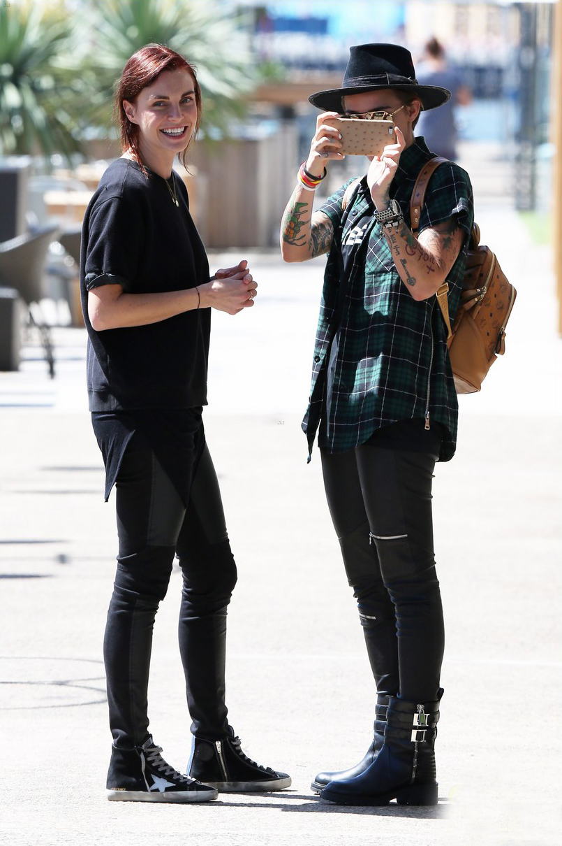 Ruby Rose and her fiancee Phoebe Dahl hold hands