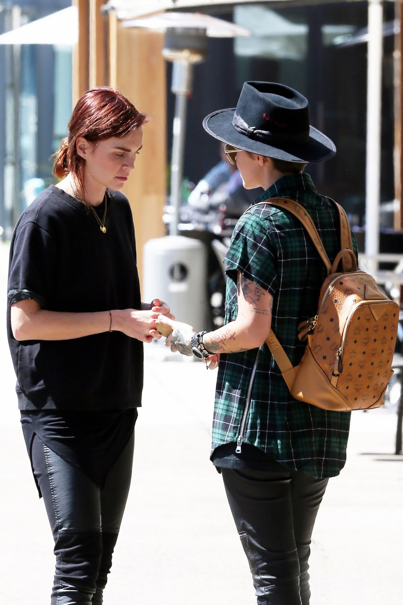 Ruby Rose and her fiancee Phoebe Dahl hold hands