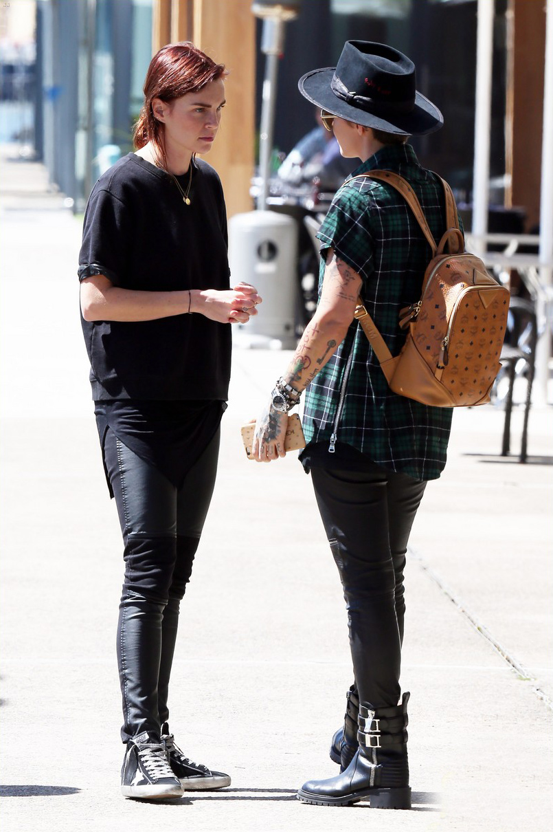 Ruby Rose and her fiancee Phoebe Dahl hold hands