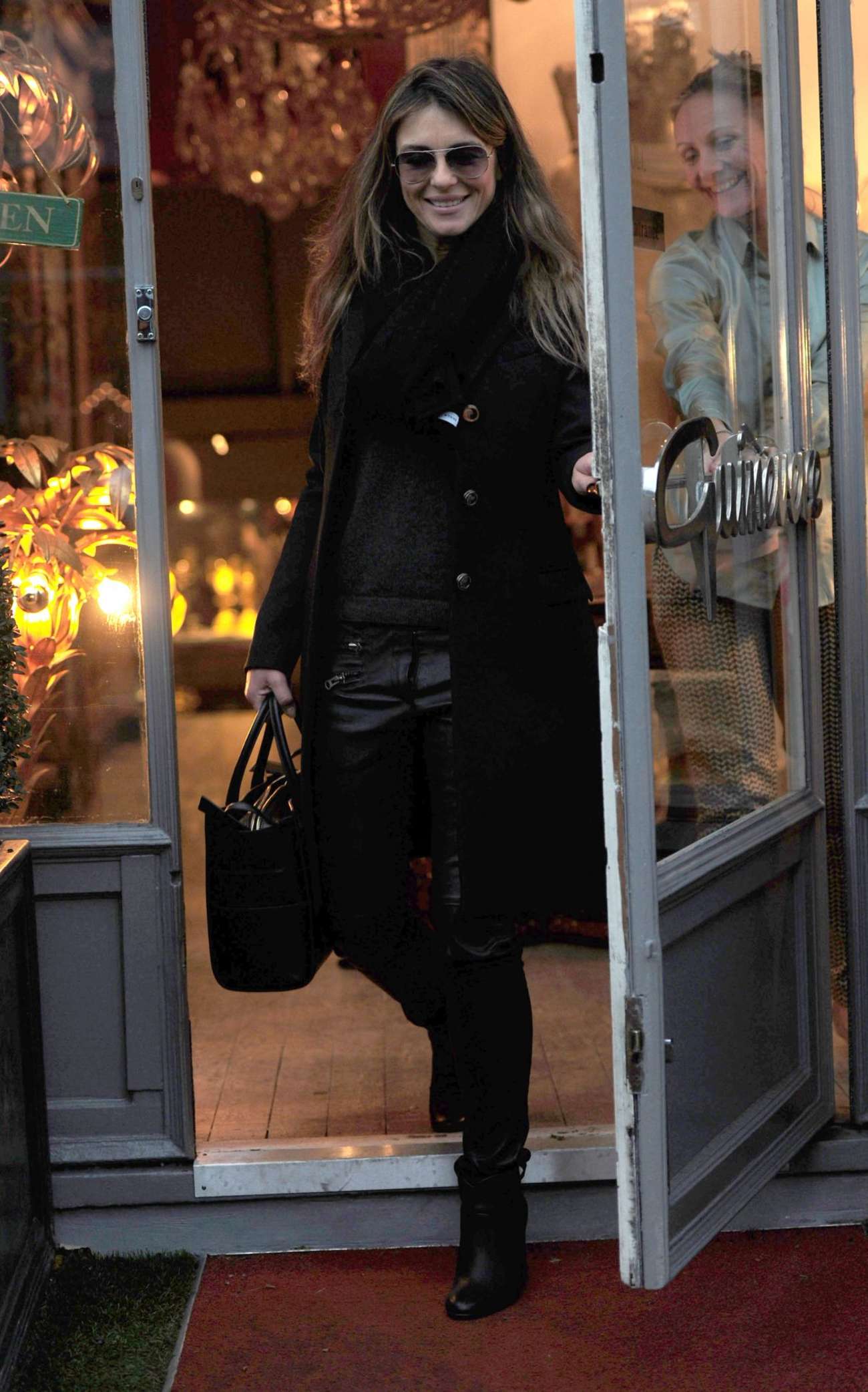 Elizabeth Hurley shopping for antiques in London