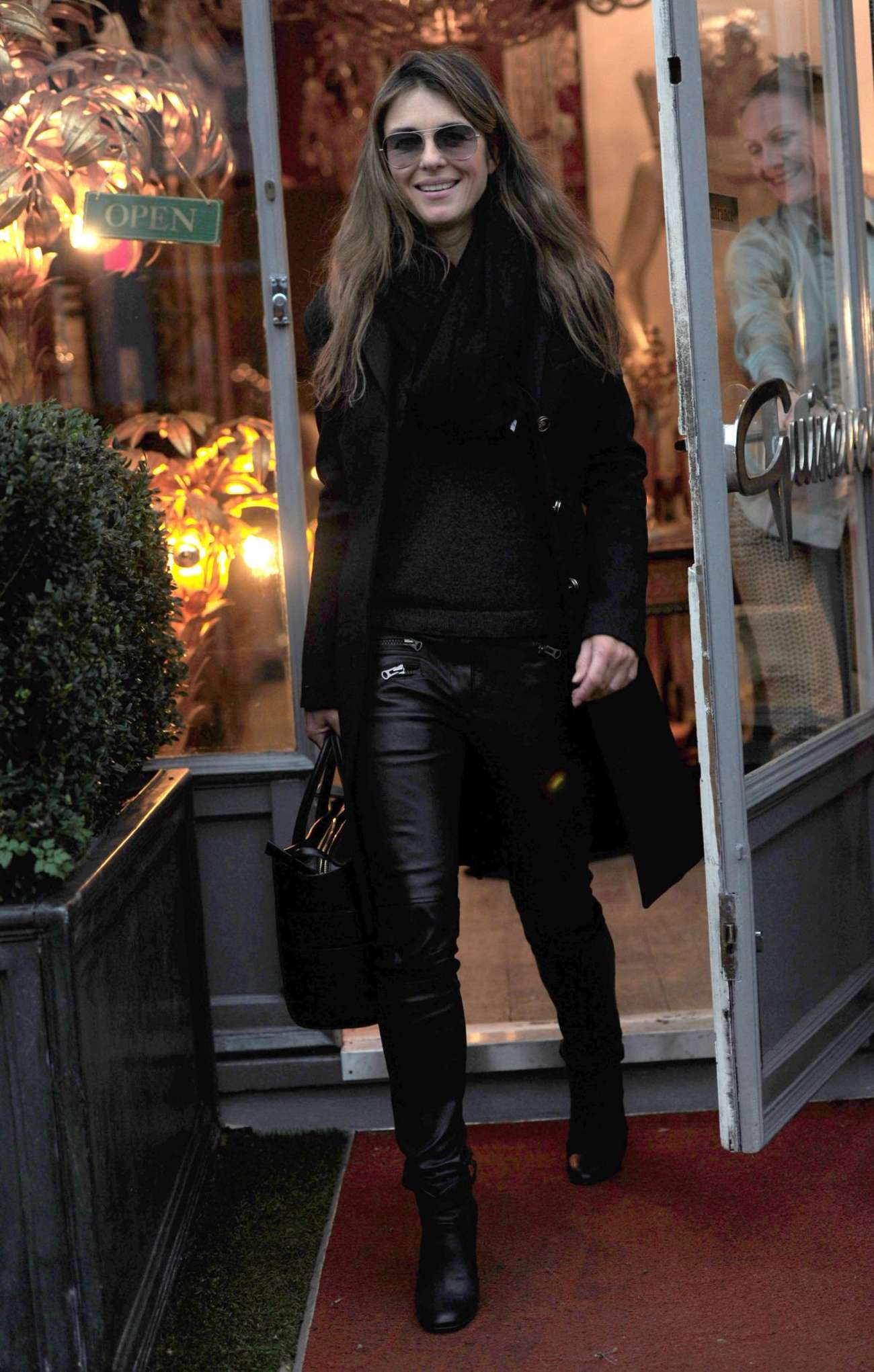 Elizabeth Hurley shopping for antiques in London