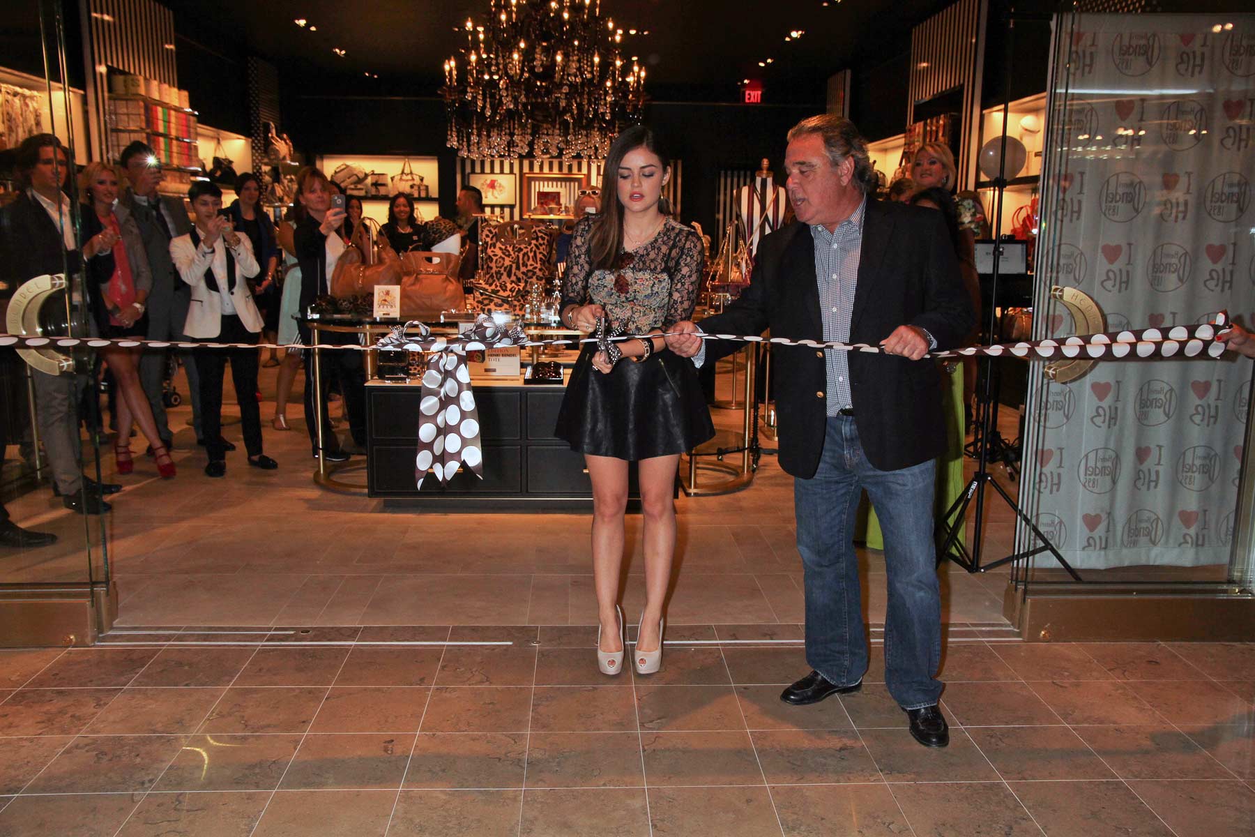 Lucy Hale attends the Fashion Show Mall