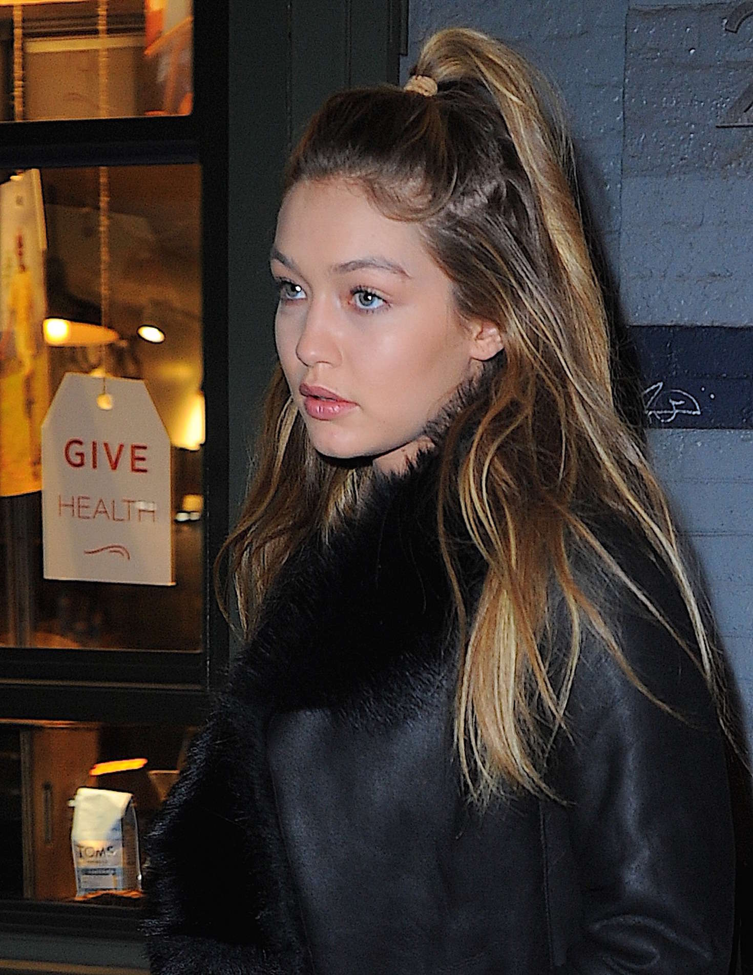 Gigi Hadid step out of an apartment building