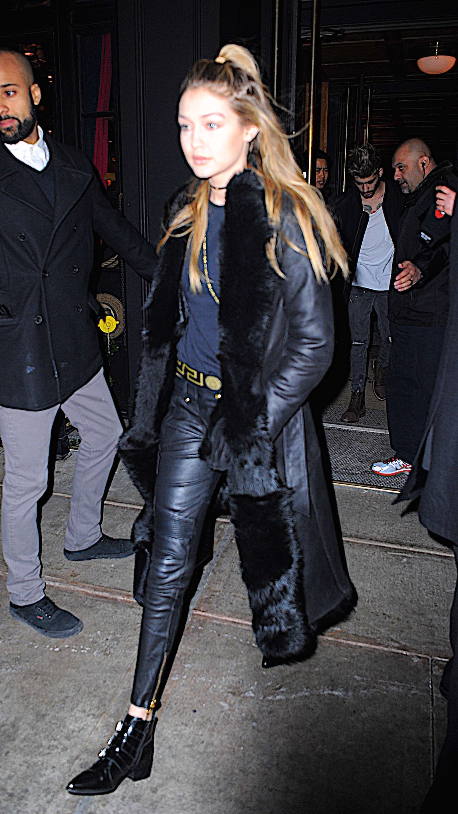 Gigi Hadid step out of an apartment building