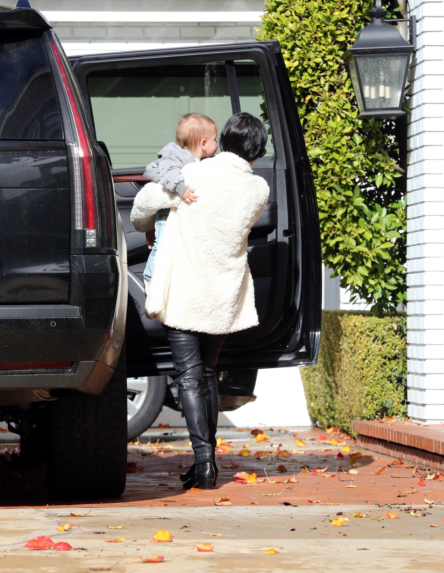 Kourtney Kardashian makes her way out of a building