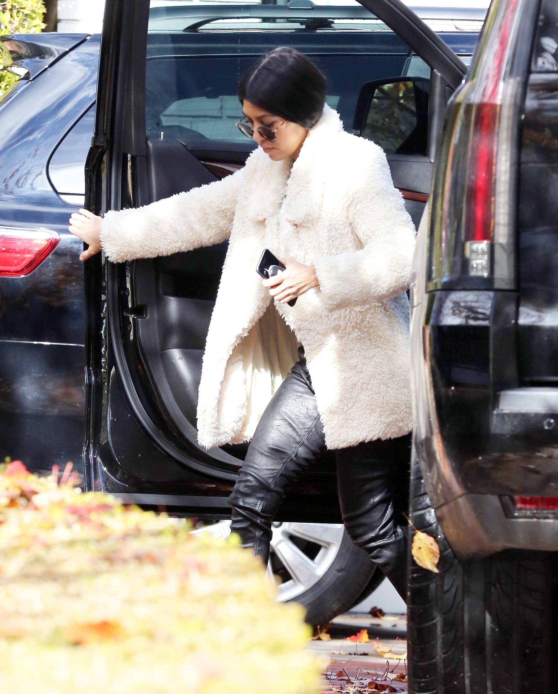 Kourtney Kardashian makes her way out of a building