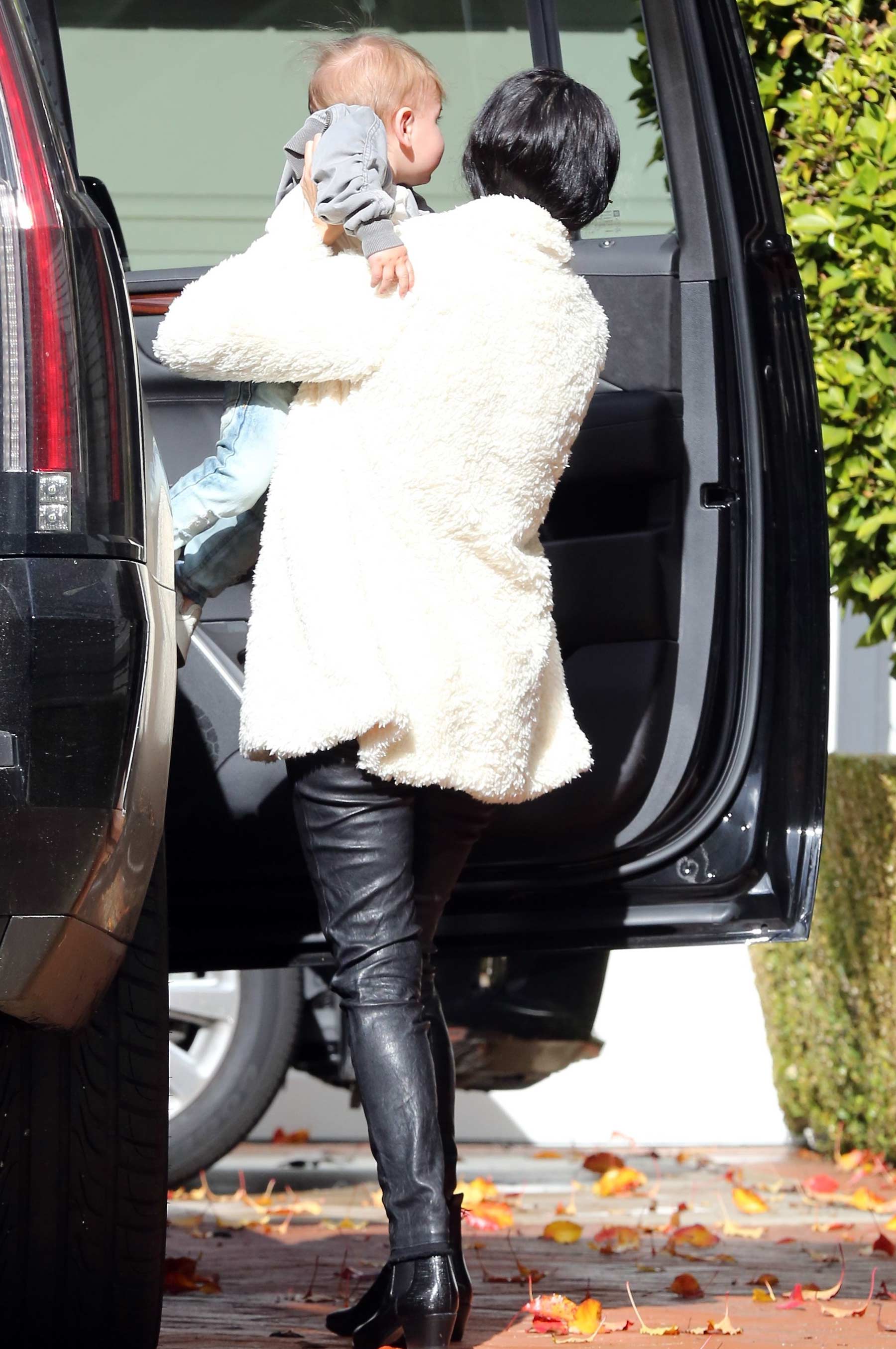 Kourtney Kardashian makes her way out of a building