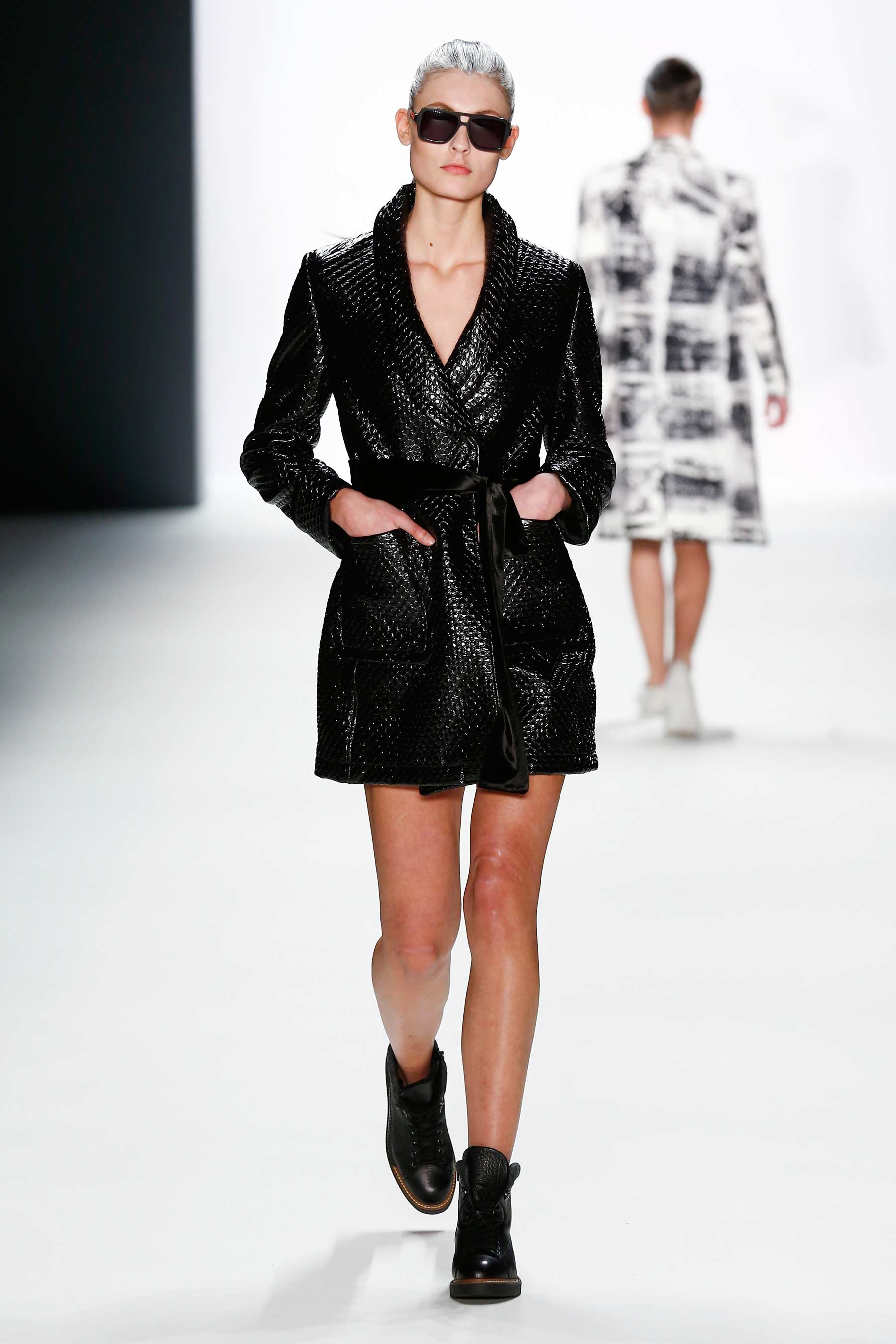 Models walk the runway at the Mercedes-Benz Fashion Week Berlin