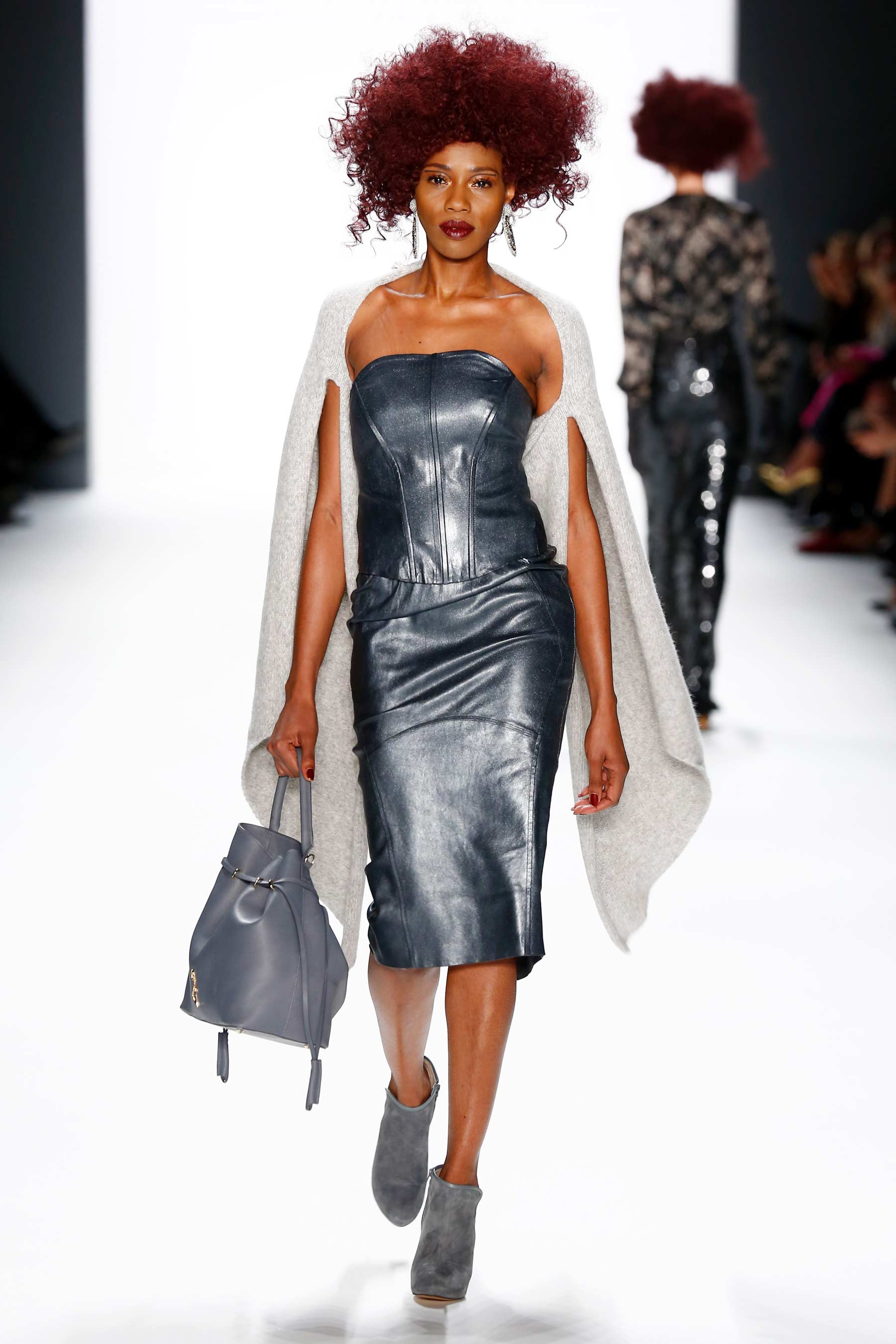 Models walk the runway at the Mercedes-Benz Fashion Week Berlin
