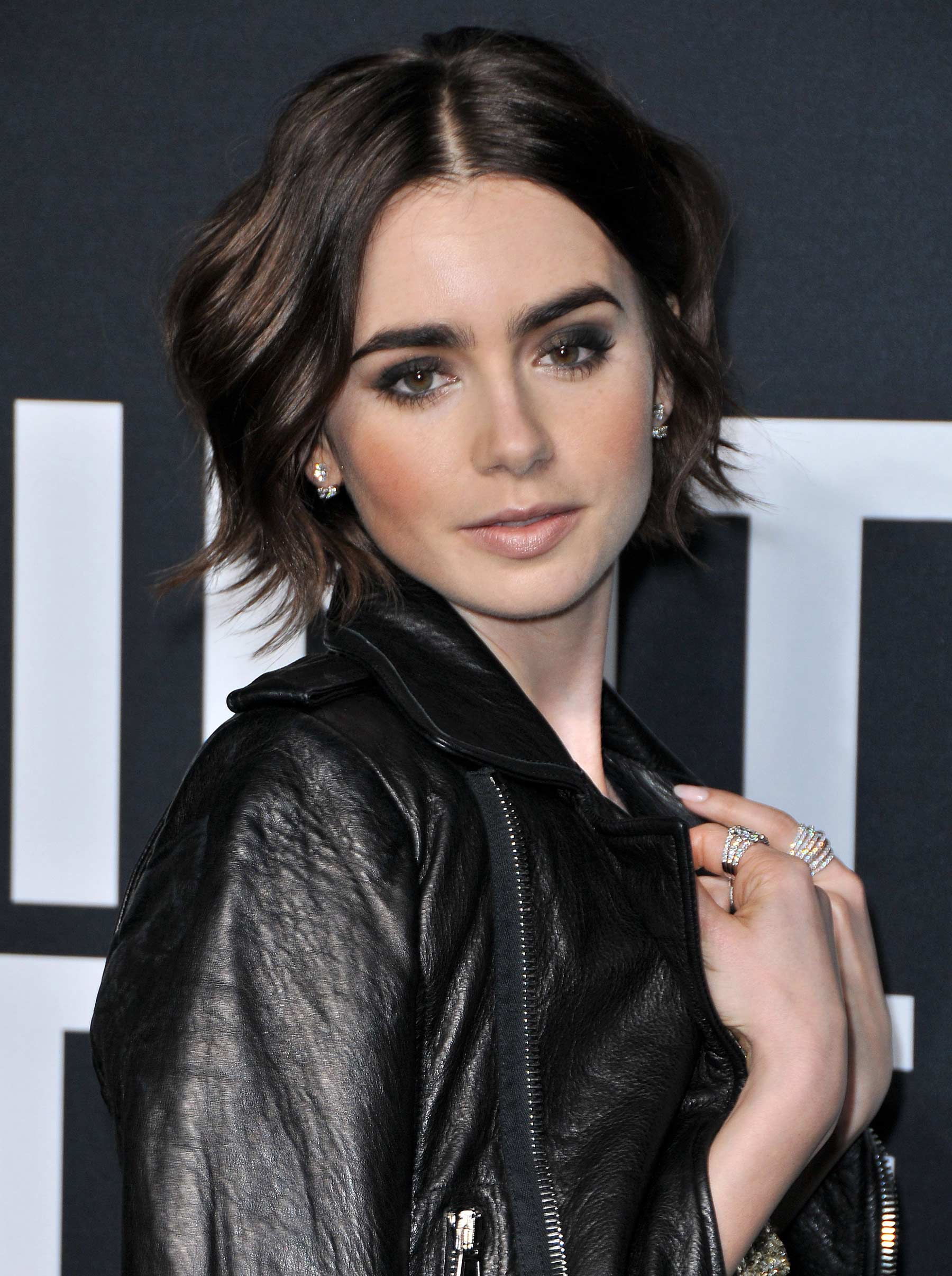 Lily Collins attends Saint Laurent Fashion Show