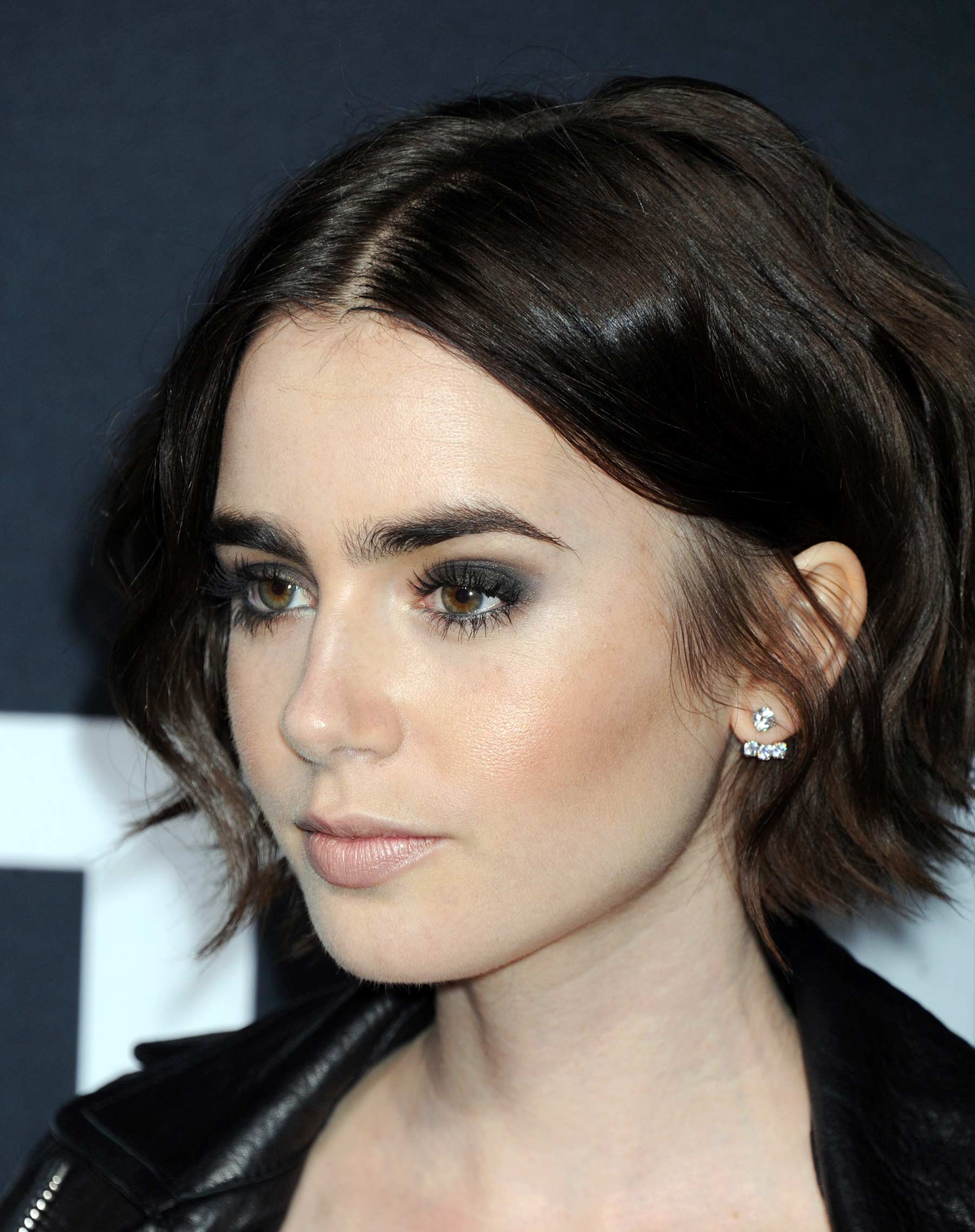 Lily Collins attends Saint Laurent Fashion Show