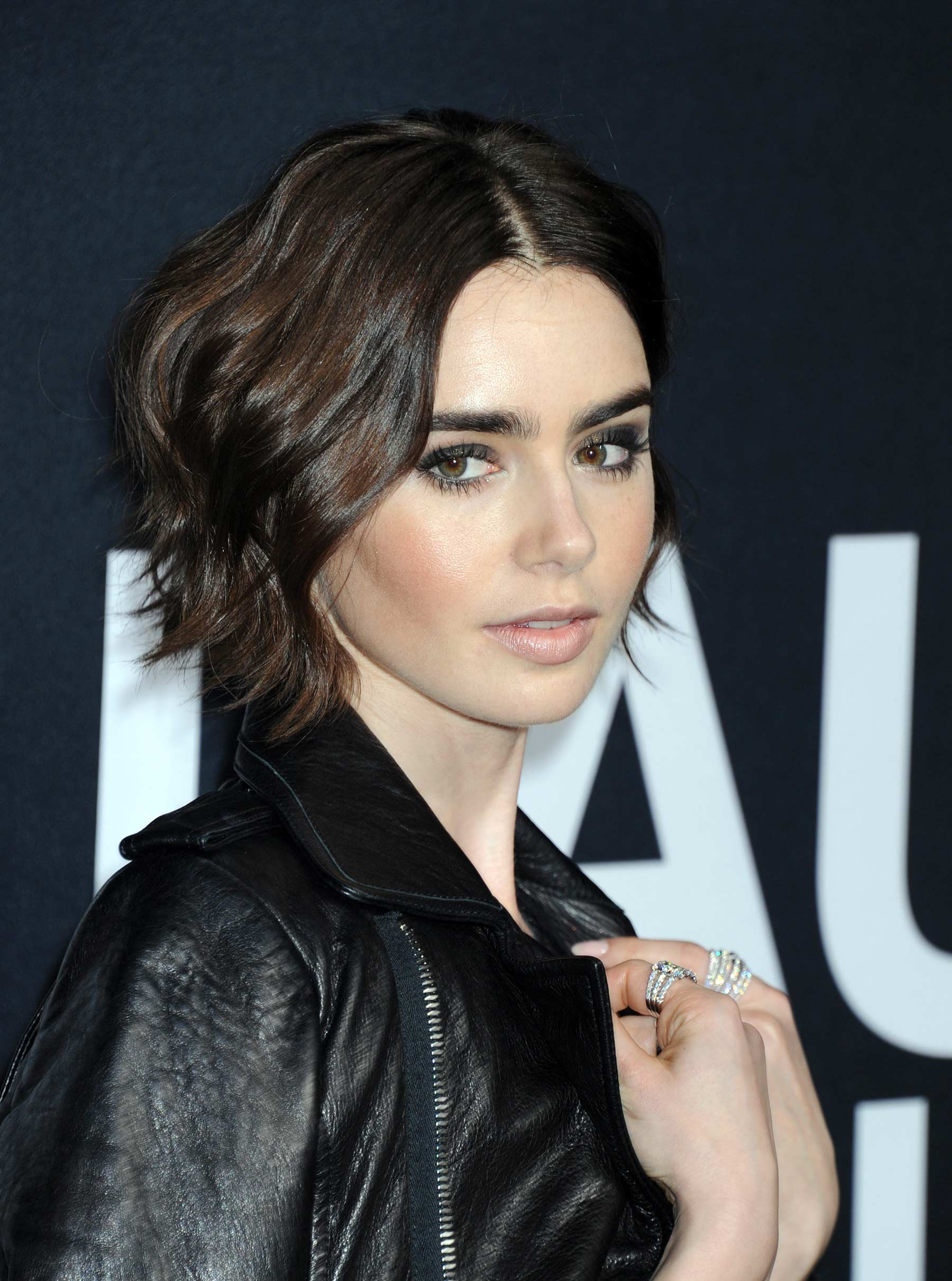 Lily Collins attends Saint Laurent Fashion Show