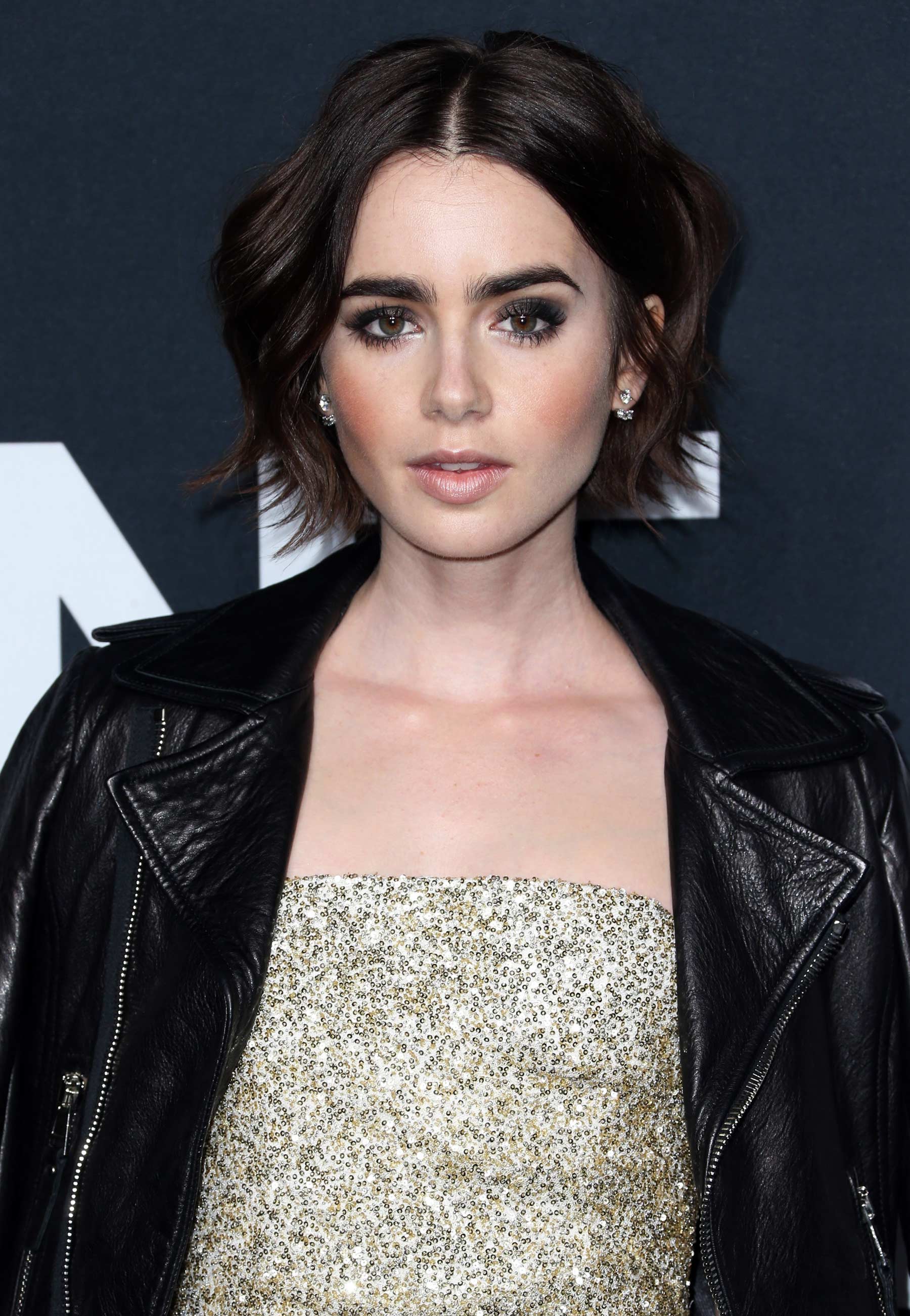 Lily Collins attends Saint Laurent Fashion Show