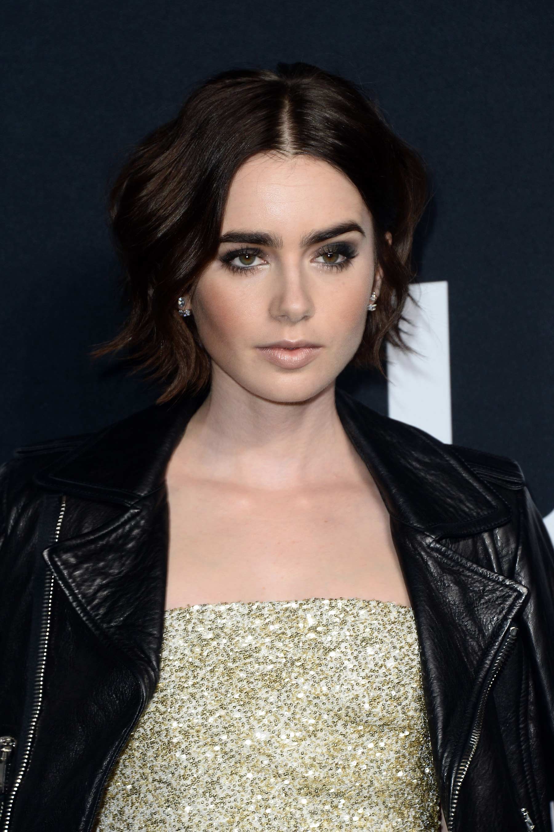 Lily Collins attends Saint Laurent Fashion Show