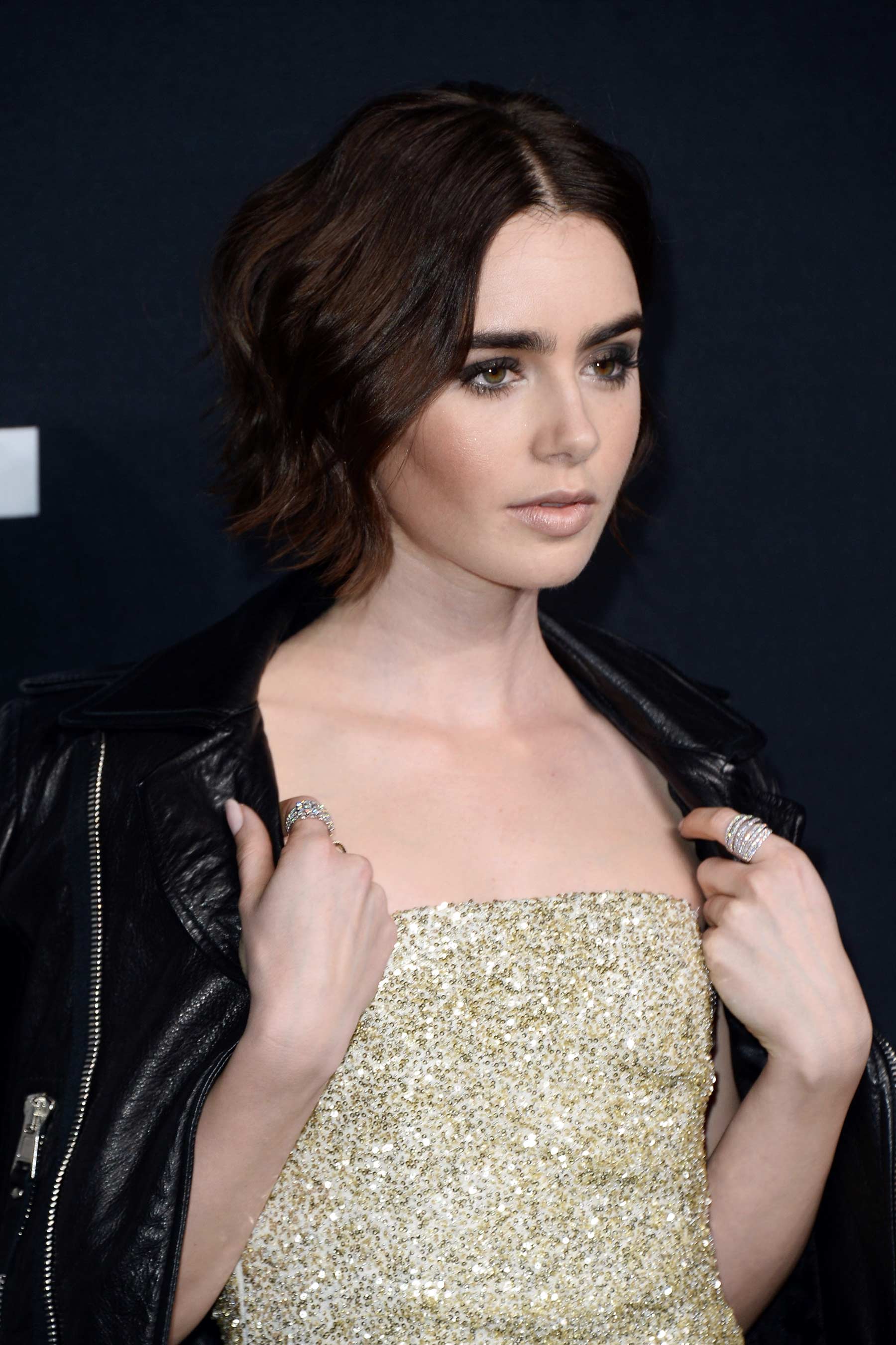 Lily Collins attends Saint Laurent Fashion Show