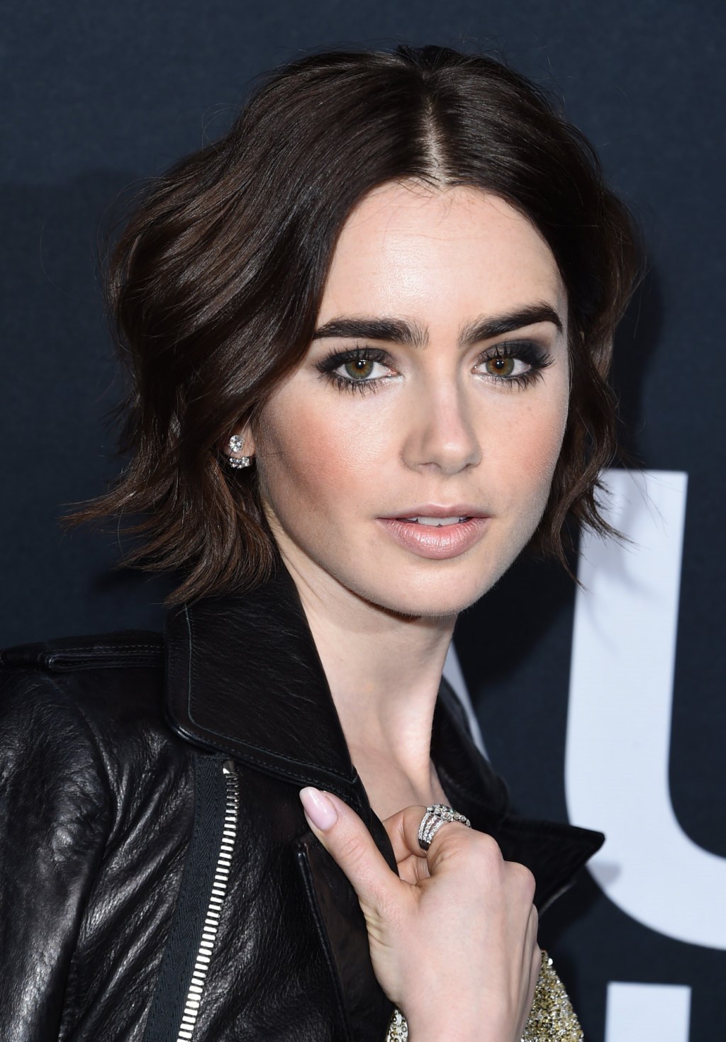 Lily Collins attends Saint Laurent Fashion Show