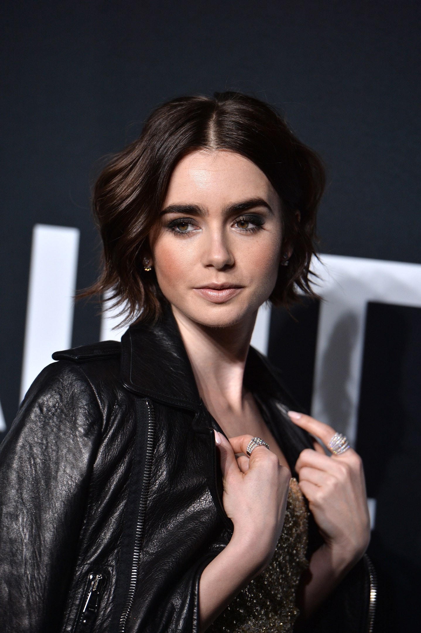 Lily Collins attends Saint Laurent Fashion Show