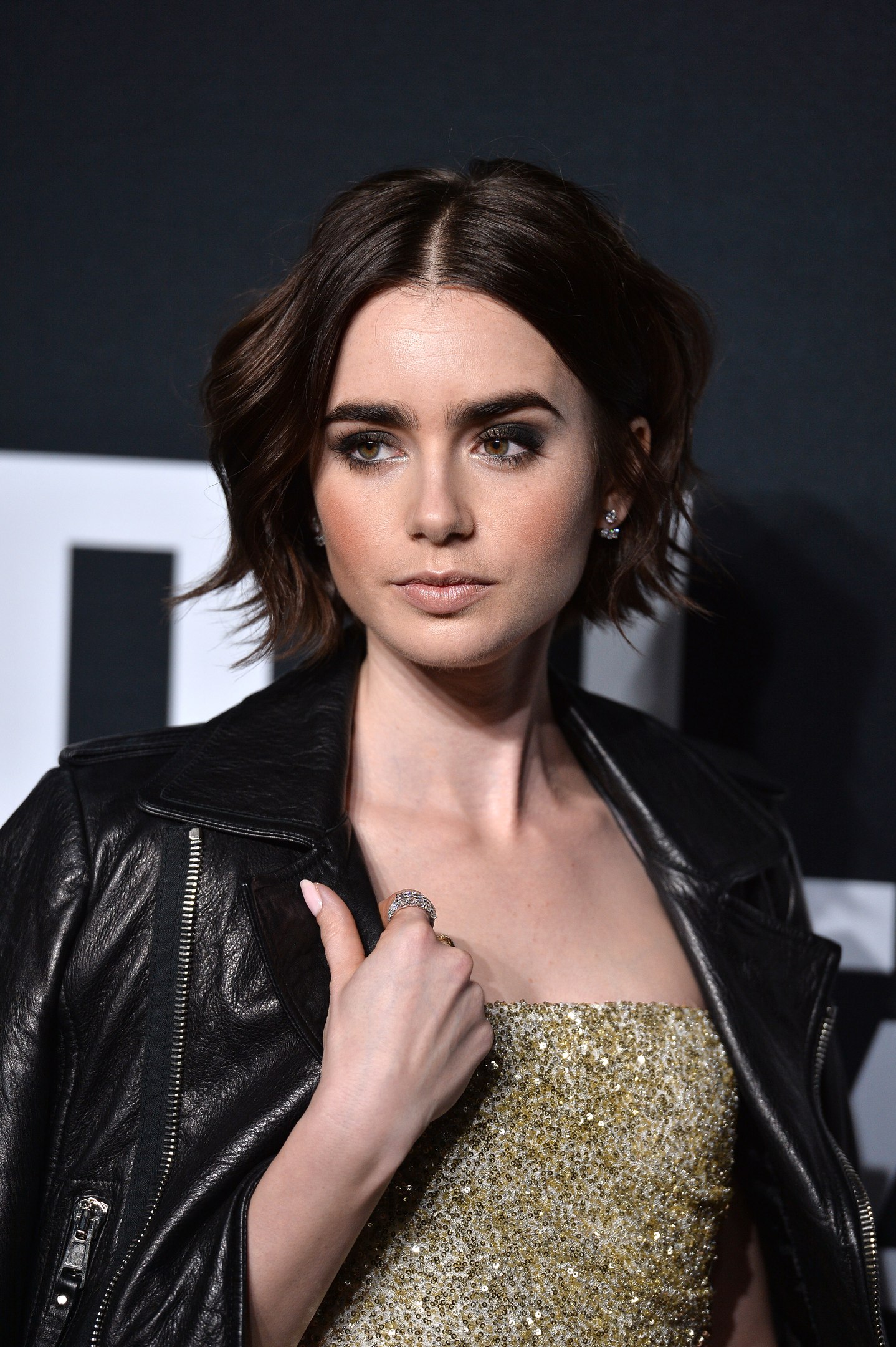 Lily Collins attends Saint Laurent Fashion Show