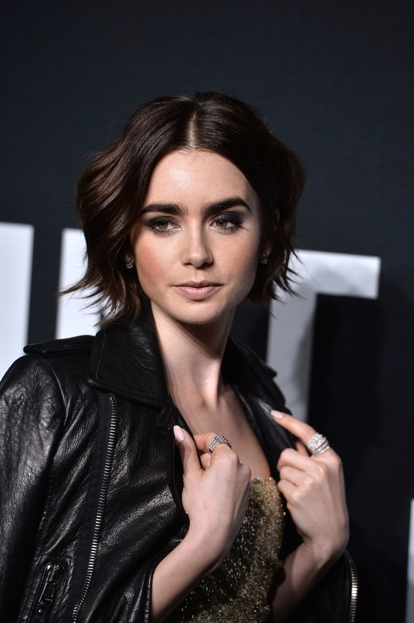 Lily Collins attends Saint Laurent Fashion Show