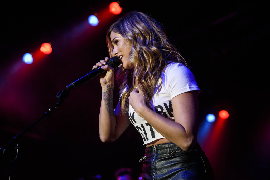 Cassadee Pope performs on stage for the I’m Comin’ Over Tour