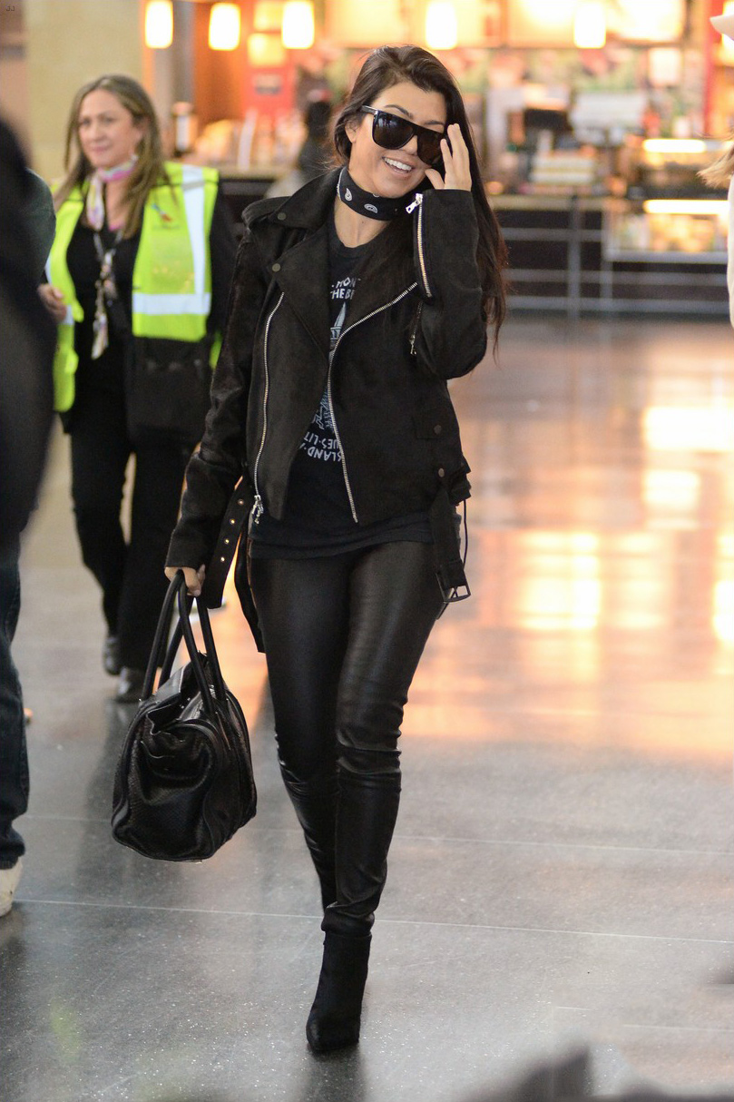 Kourtney Kardashian is seen at LAX and JFK airports