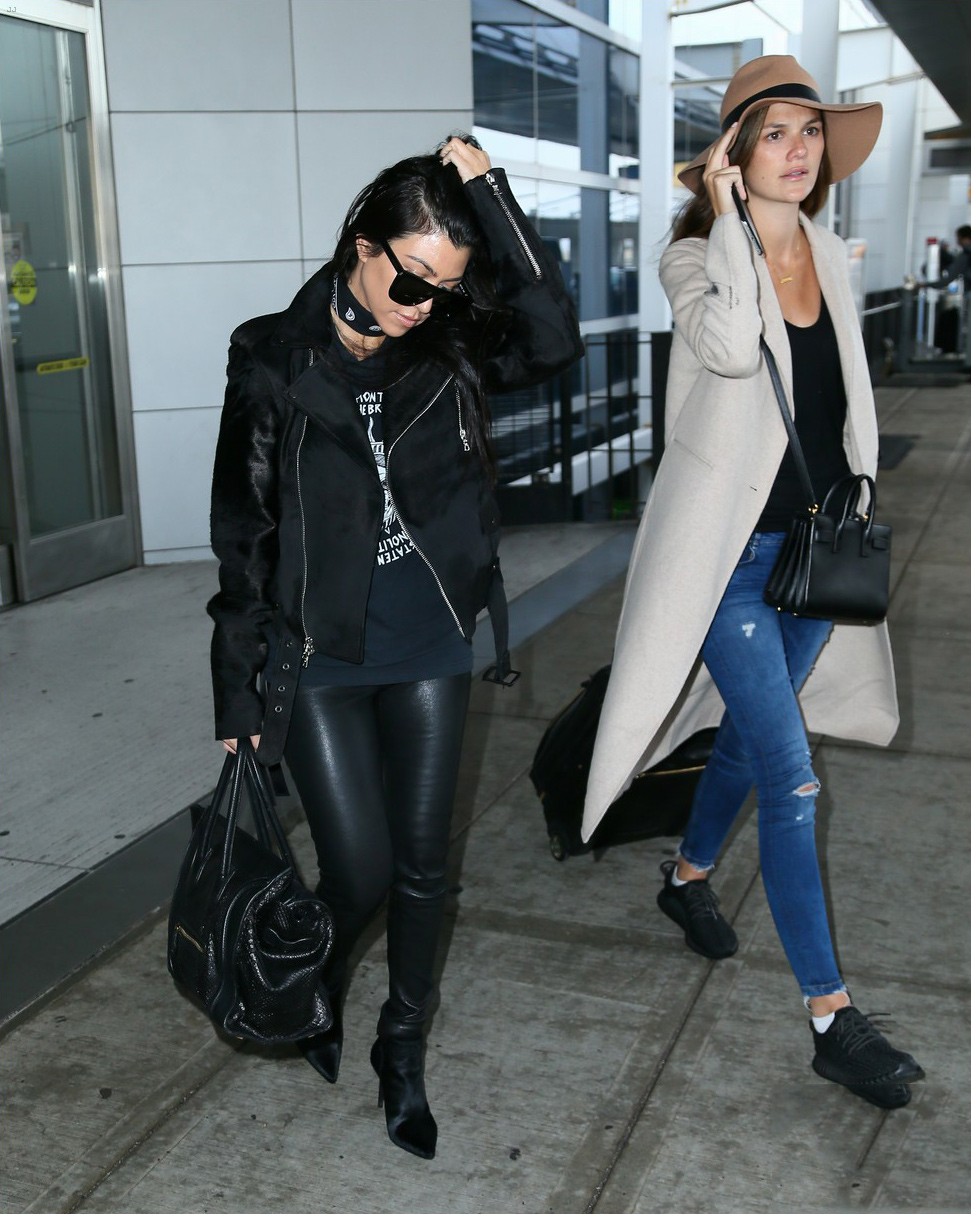 Kourtney Kardashian is seen at LAX and JFK airports