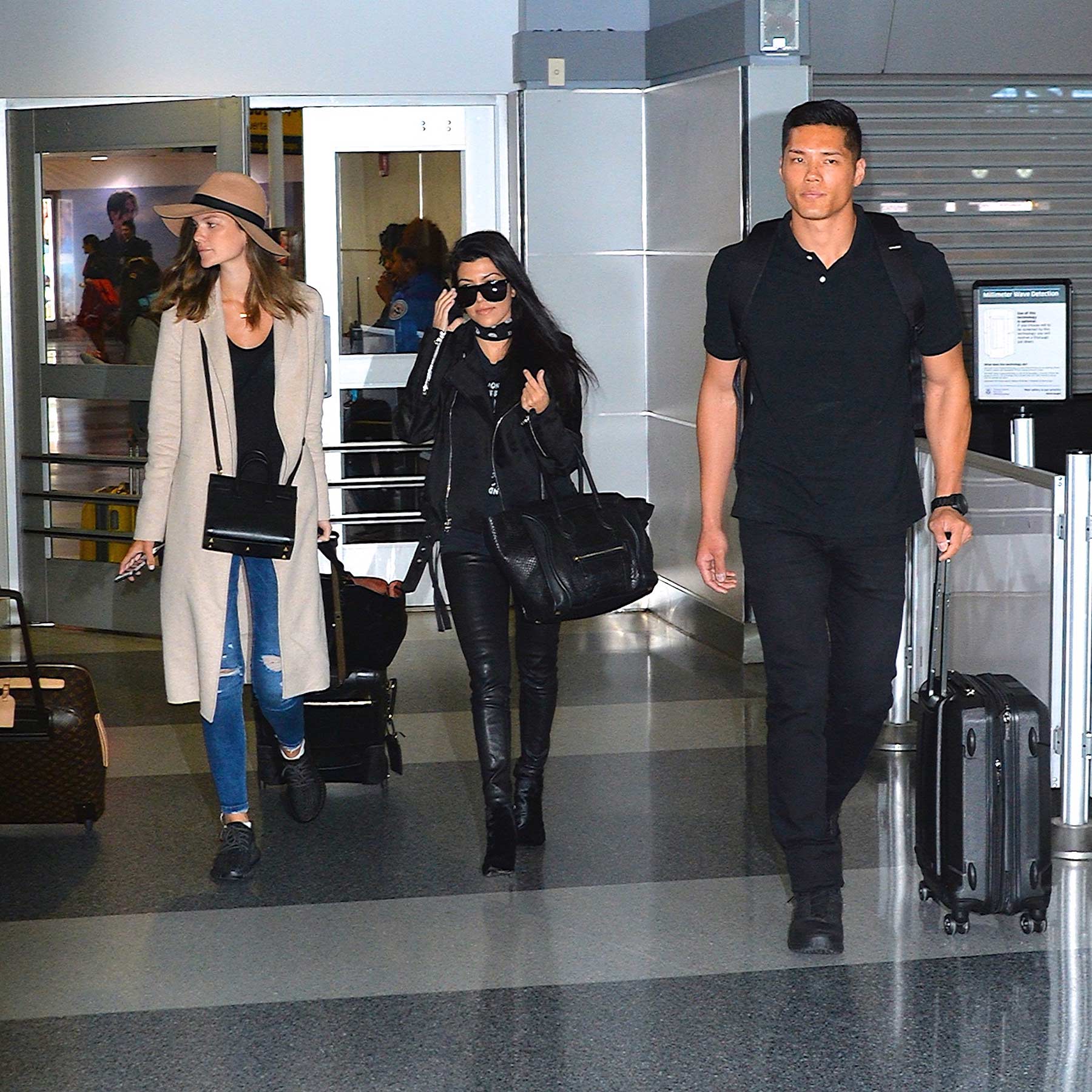 Kourtney Kardashian is seen at LAX and JFK airports