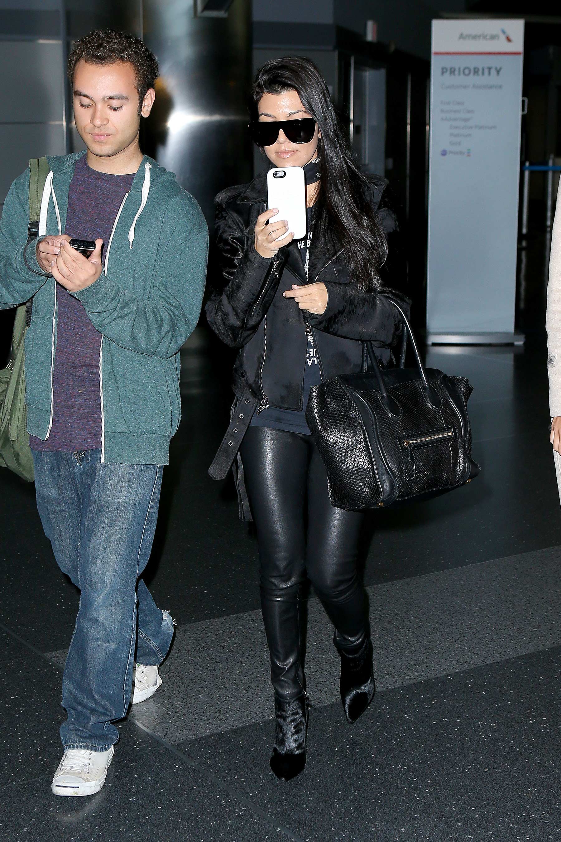 Kourtney Kardashian is seen at LAX and JFK airports