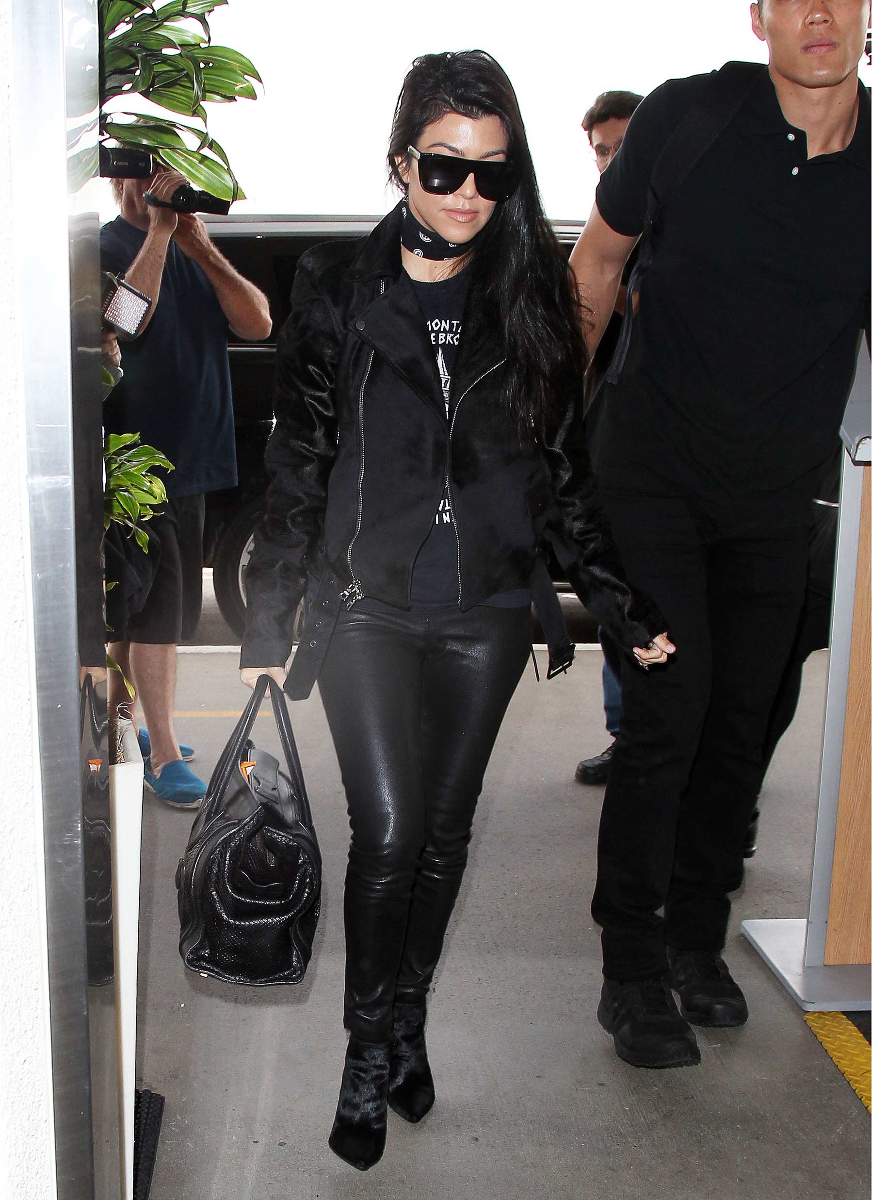 Kourtney Kardashian is seen at LAX and JFK airports