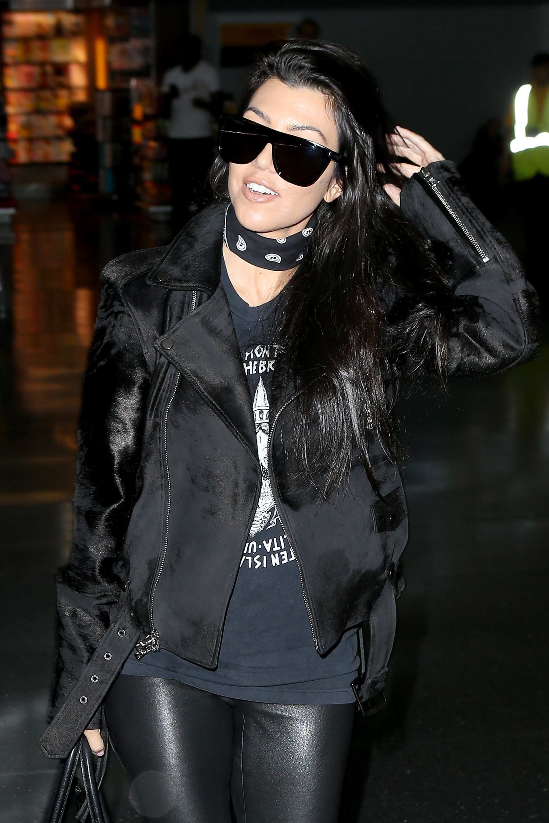 Kourtney Kardashian is seen at LAX and JFK airports