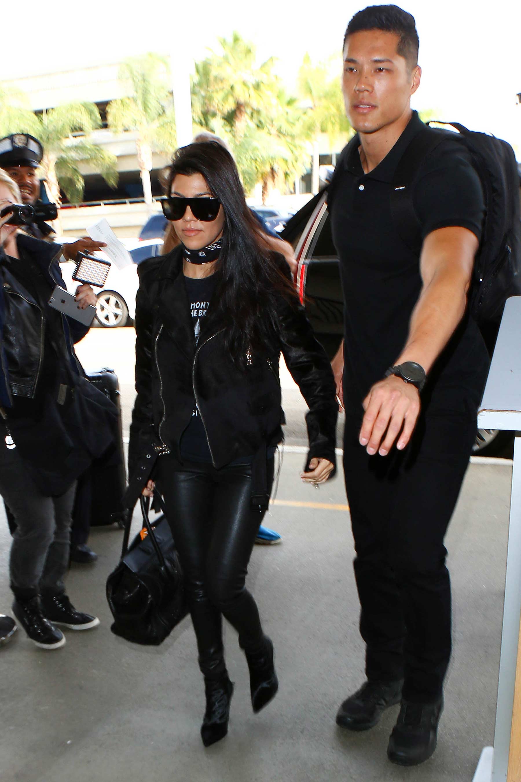 Kourtney Kardashian is seen at LAX and JFK airports