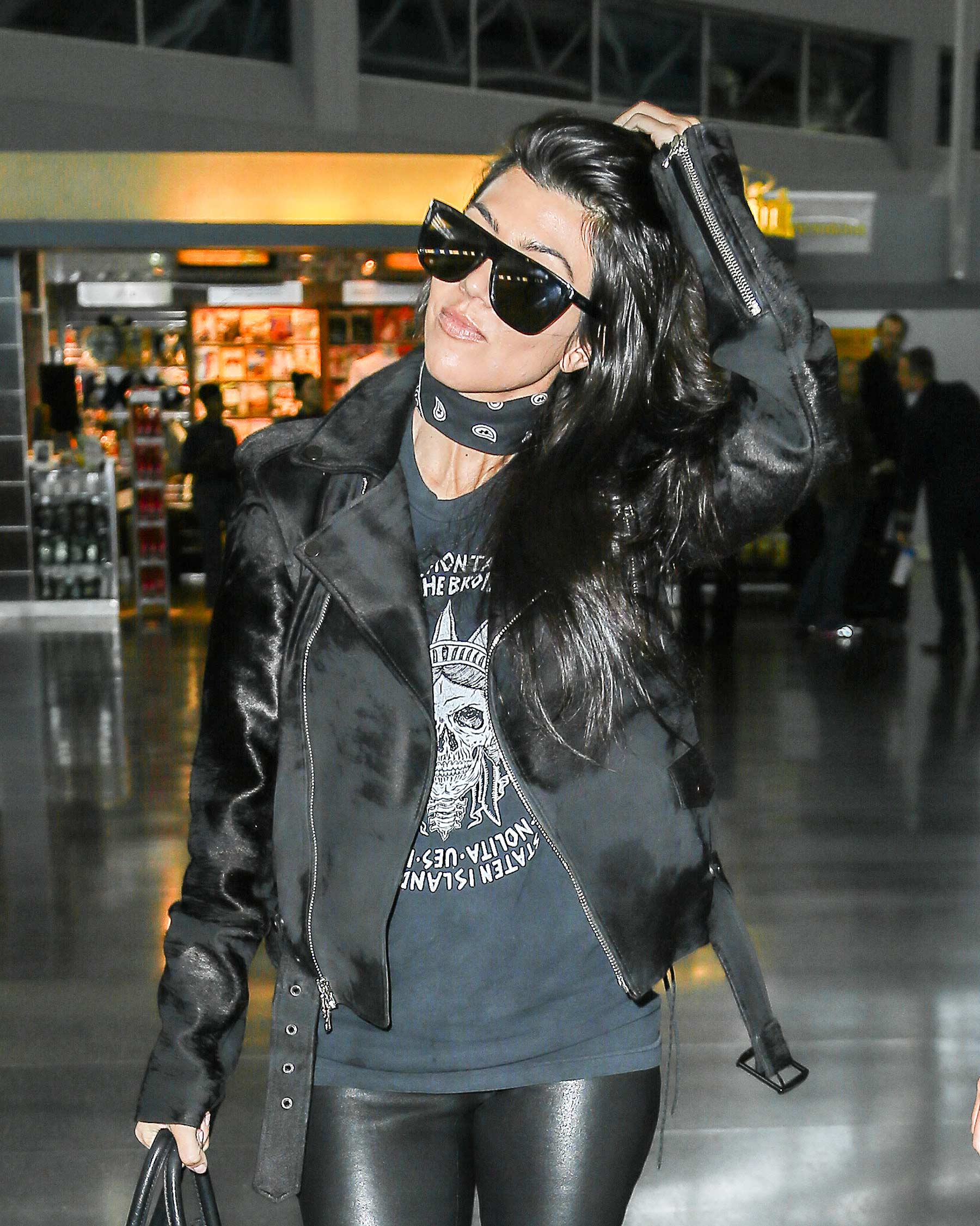 Kourtney Kardashian is seen at LAX and JFK airports