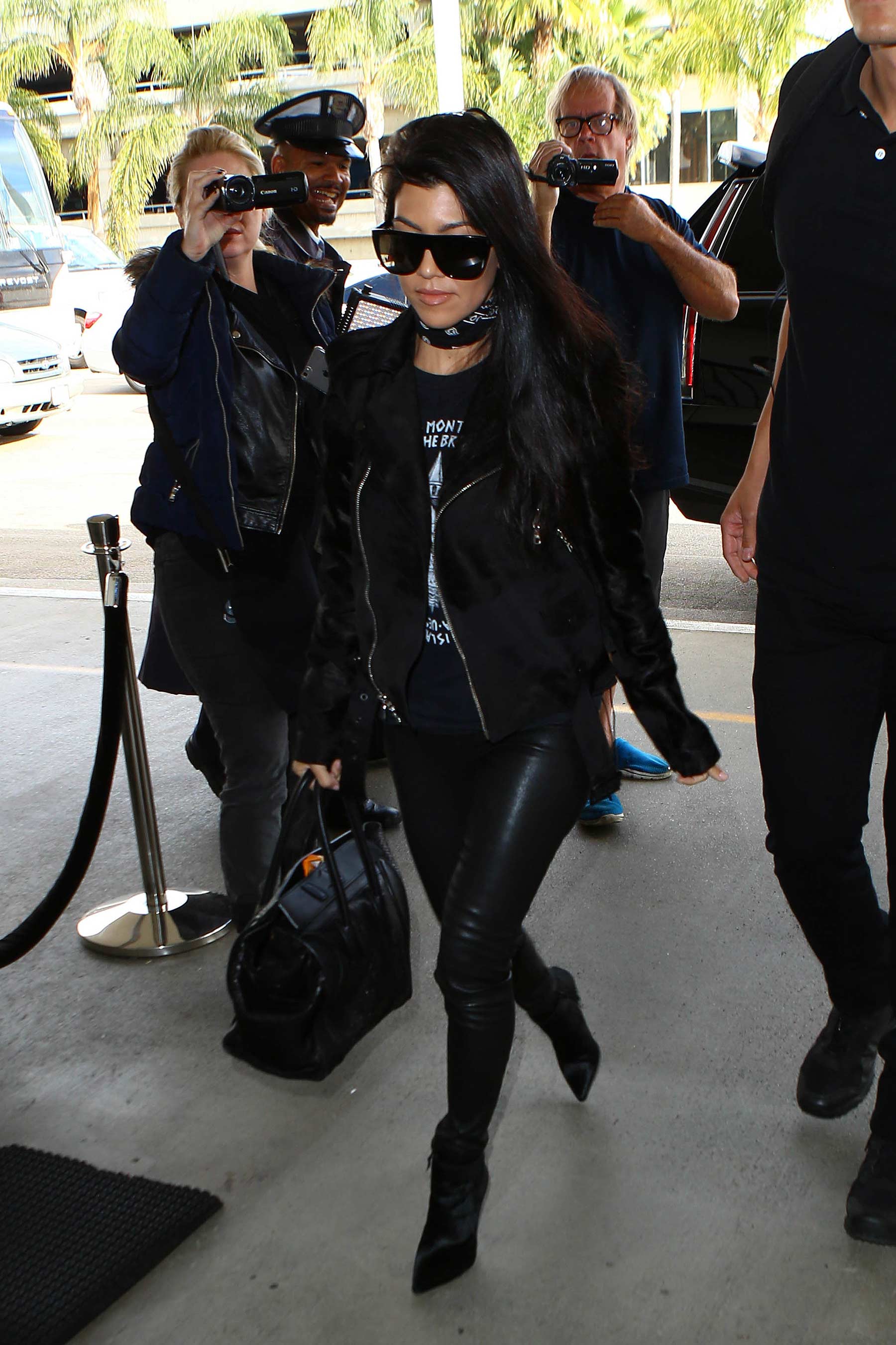 Kourtney Kardashian is seen at LAX and JFK airports