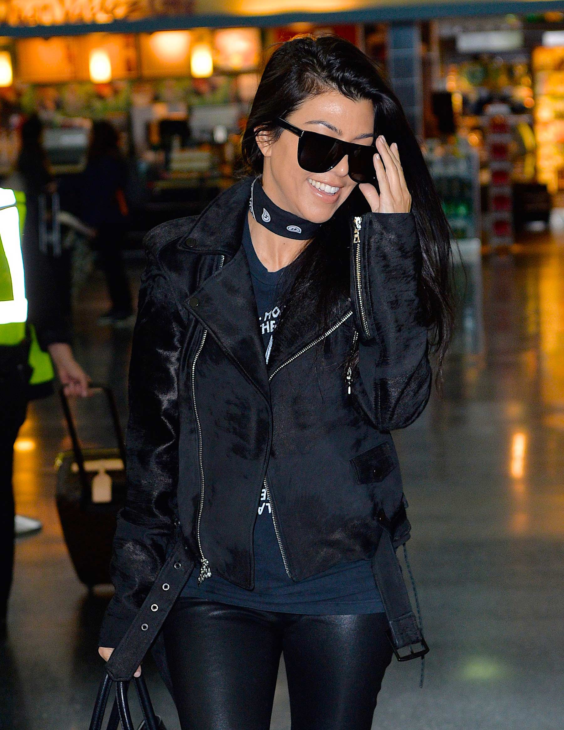 Kourtney Kardashian is seen at LAX and JFK airports