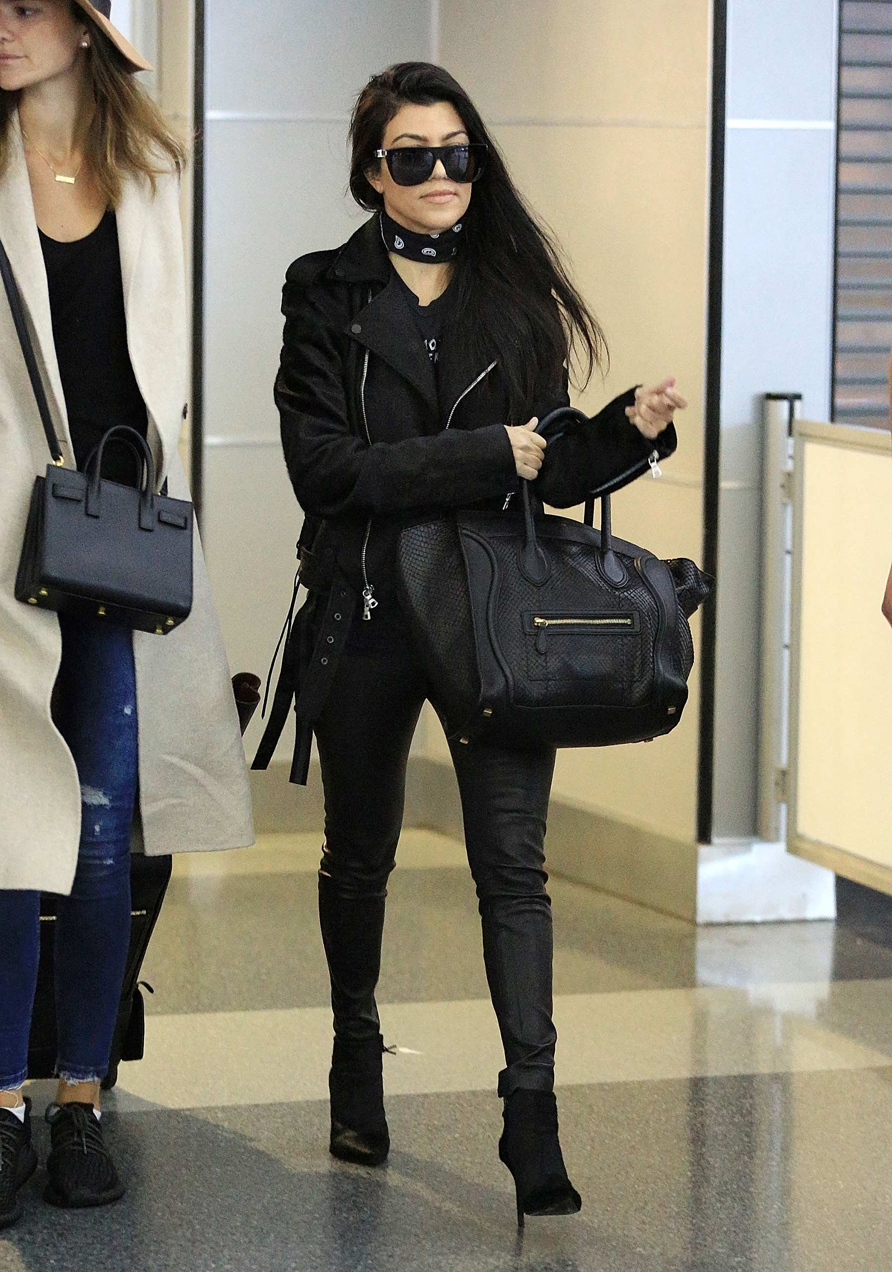 Kourtney Kardashian is seen at LAX and JFK airports