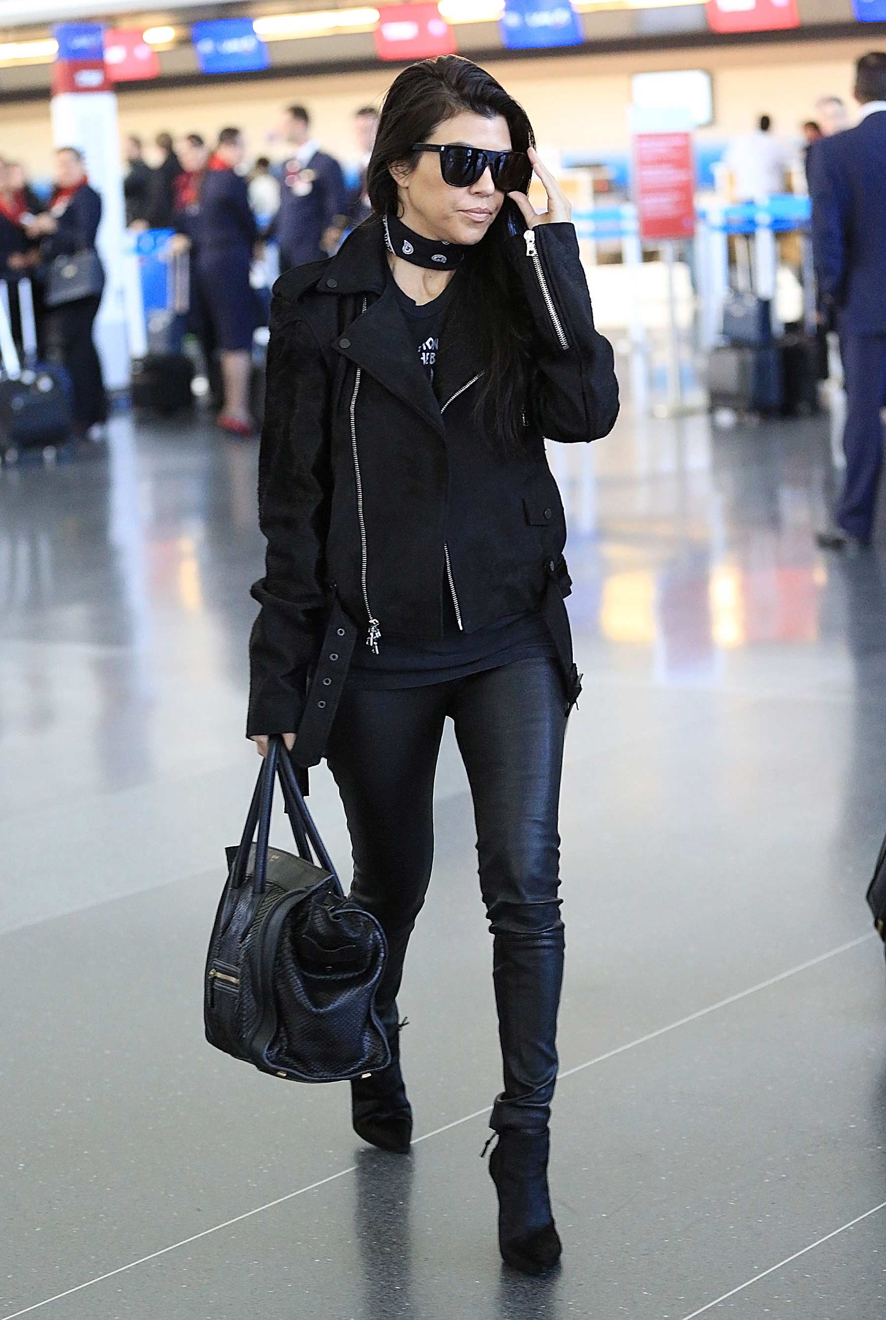 Kourtney Kardashian is seen at LAX and JFK airports