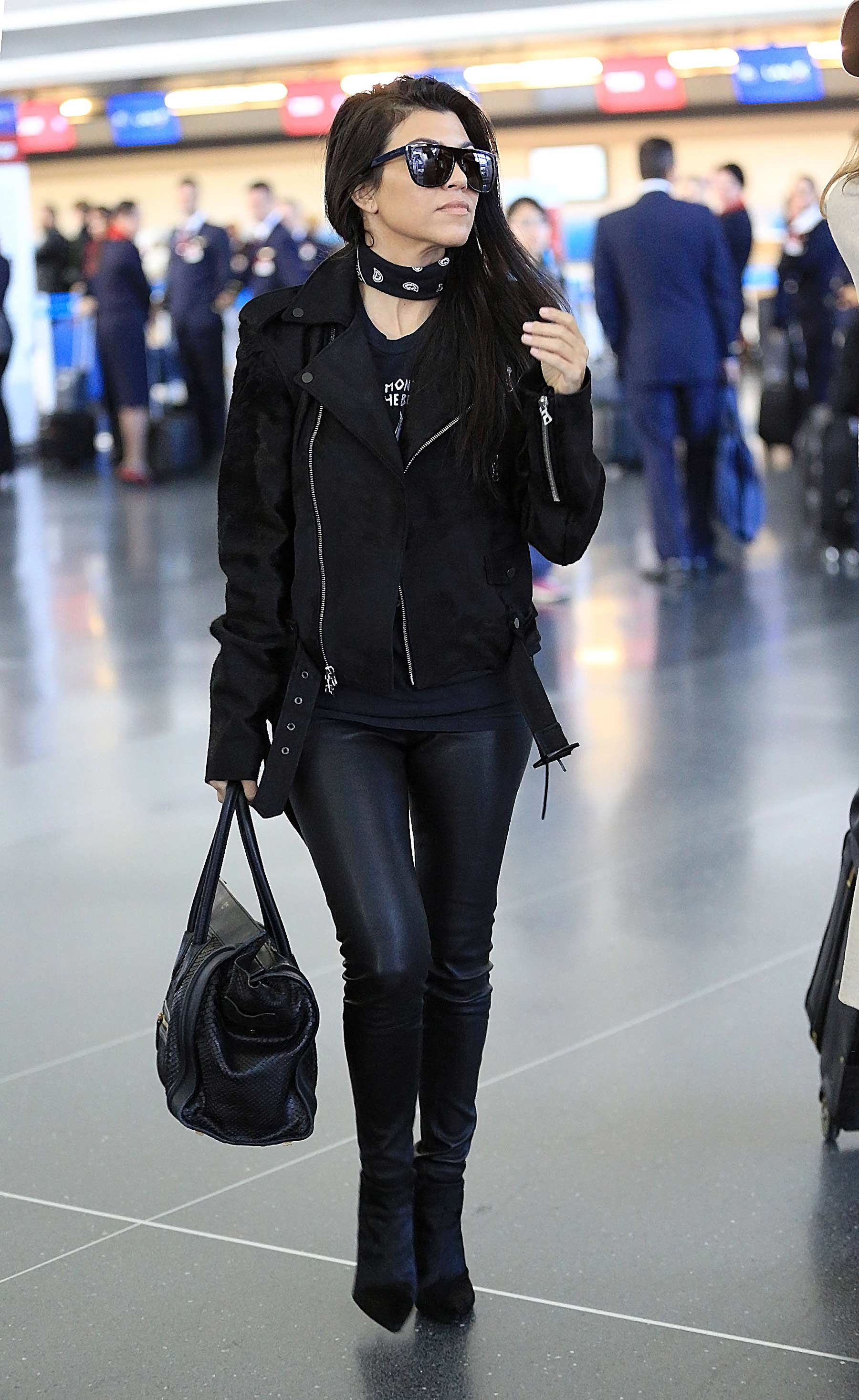 Kourtney Kardashian is seen at LAX and JFK airports