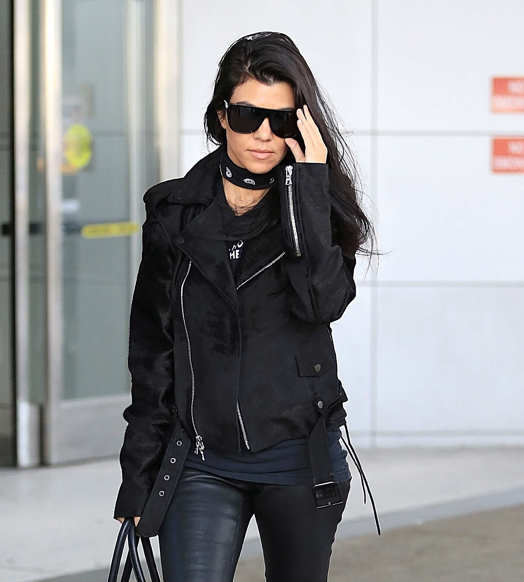 Kourtney Kardashian is seen at LAX and JFK airports