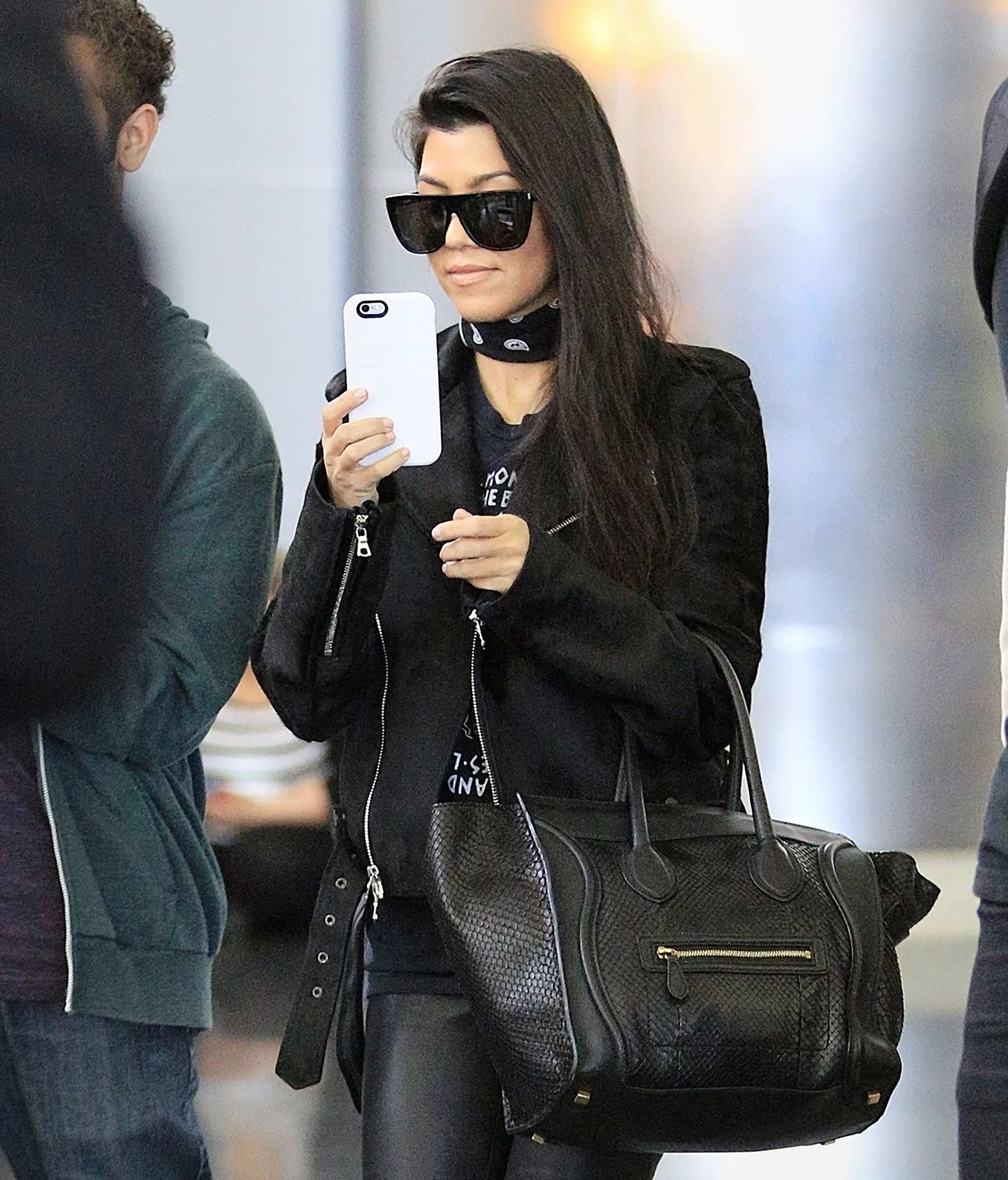 Kourtney Kardashian is seen at LAX and JFK airports