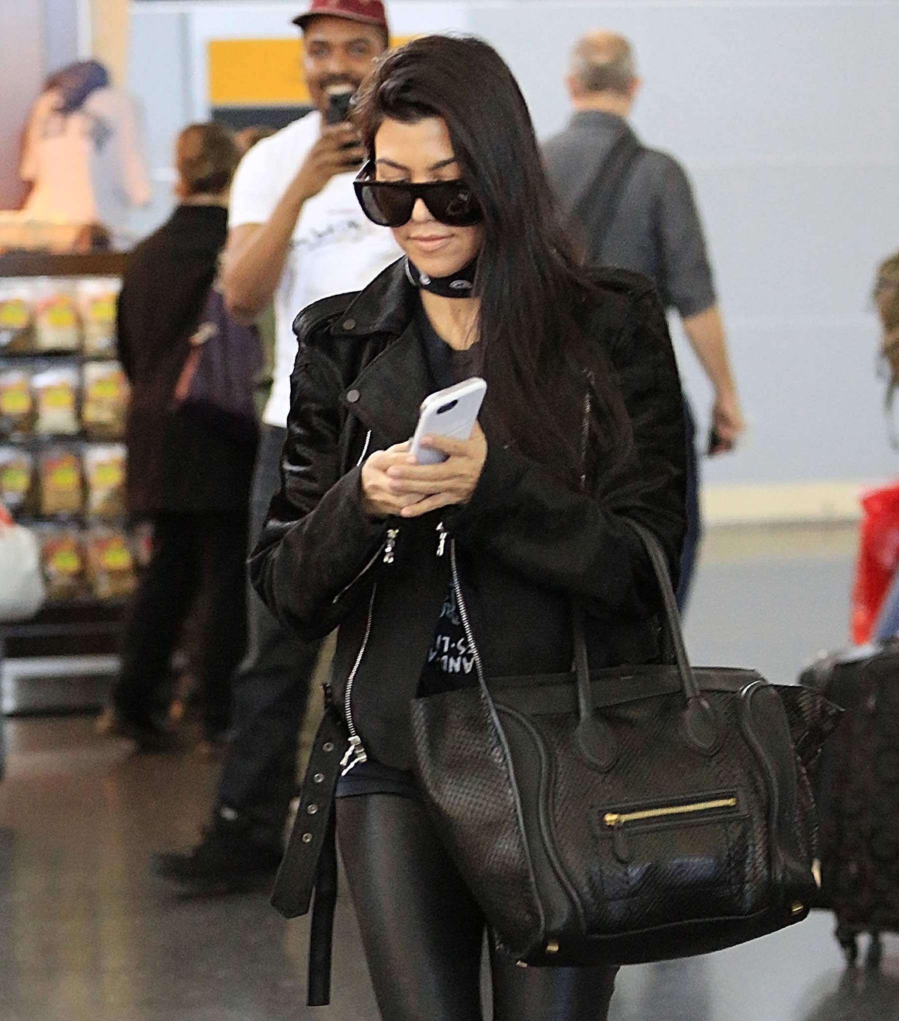 Kourtney Kardashian is seen at LAX and JFK airports