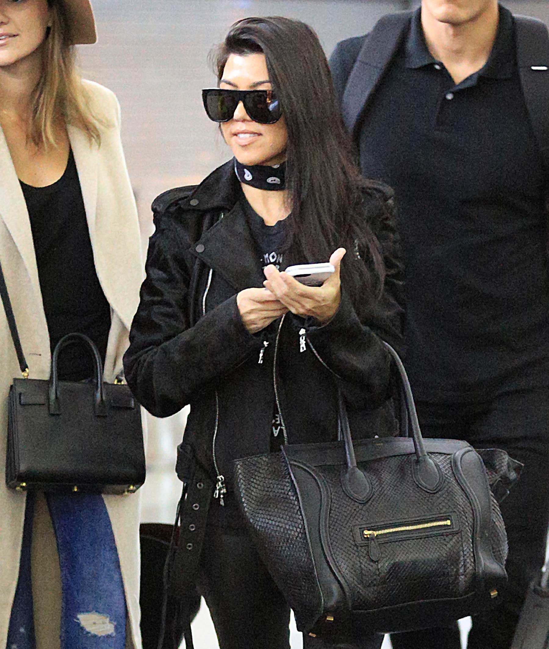 Kourtney Kardashian is seen at LAX and JFK airports