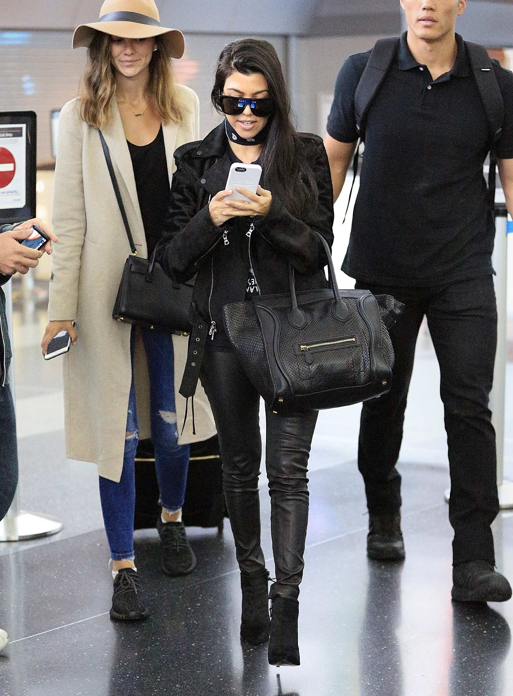 Kourtney Kardashian is seen at LAX and JFK airports