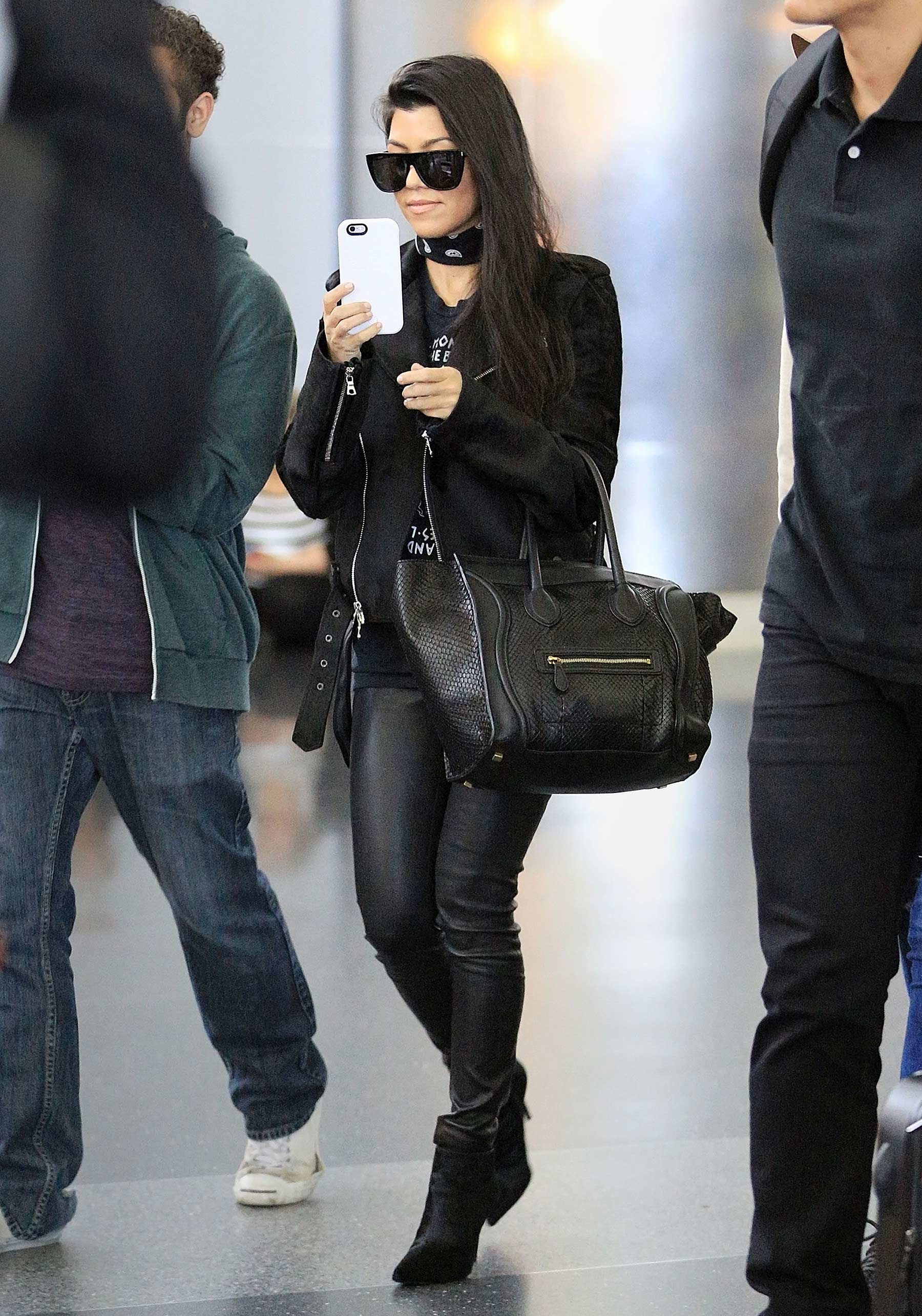 Kourtney Kardashian is seen at LAX and JFK airports