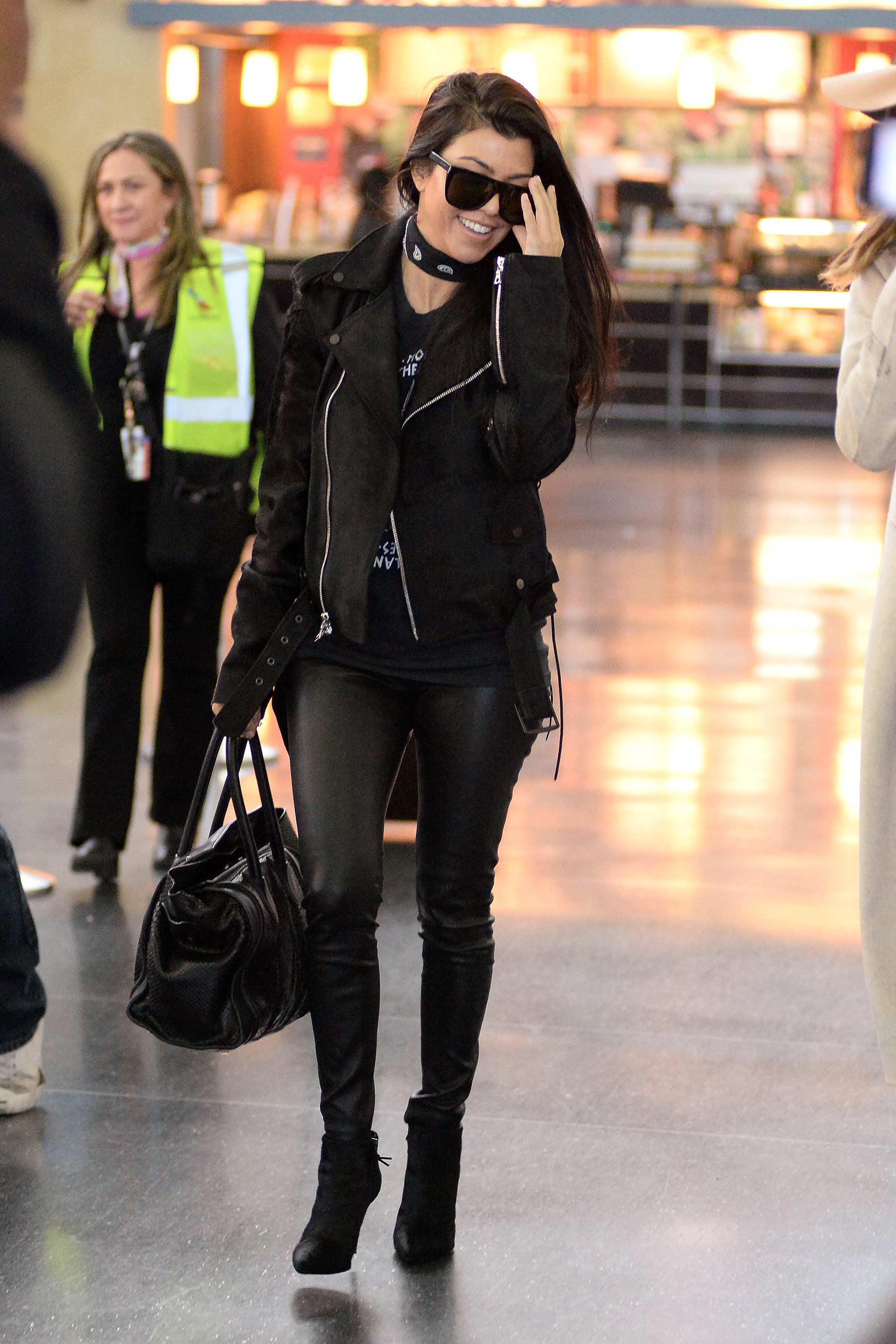 Kourtney Kardashian is seen at LAX and JFK airports