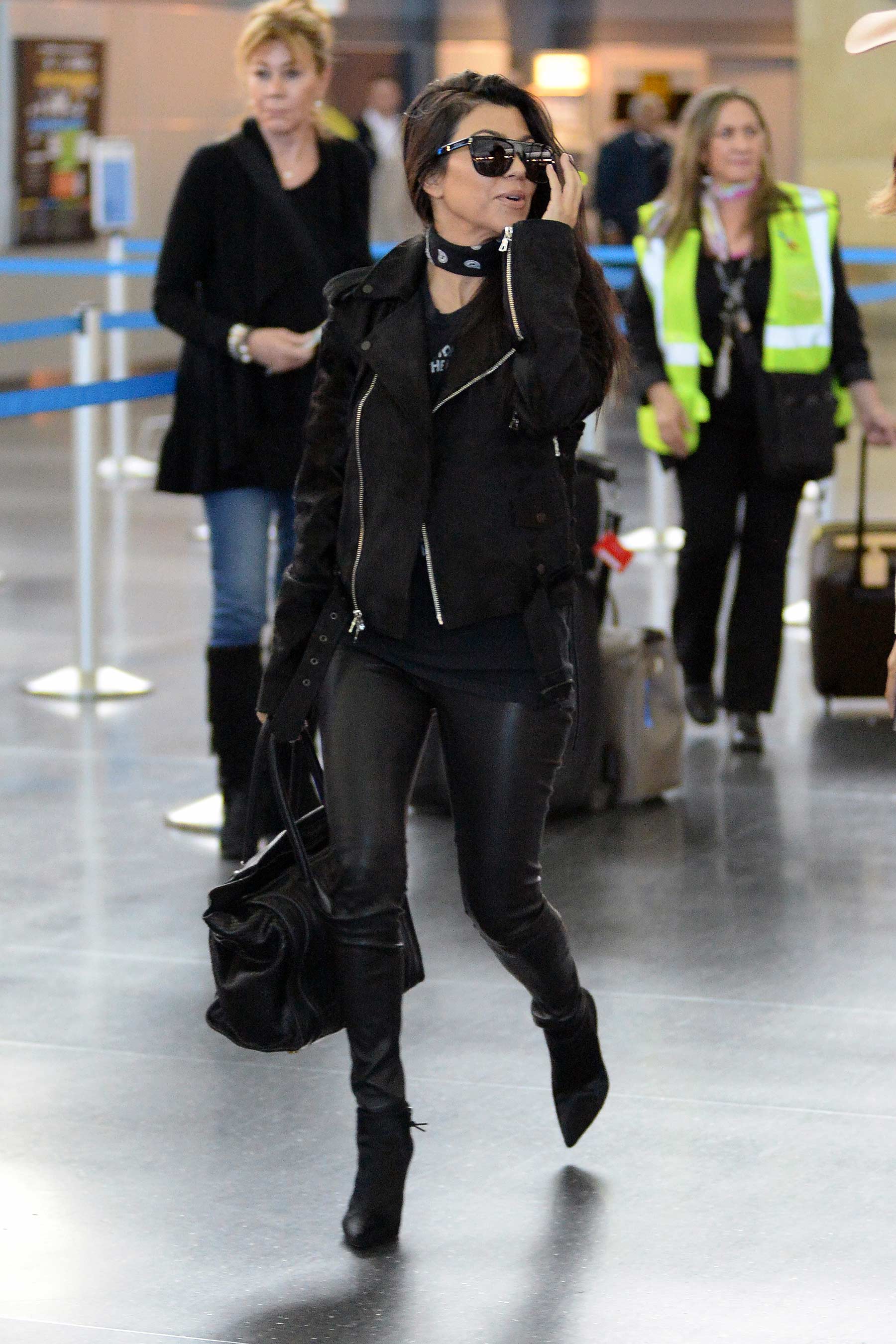 Kourtney Kardashian is seen at LAX and JFK airports