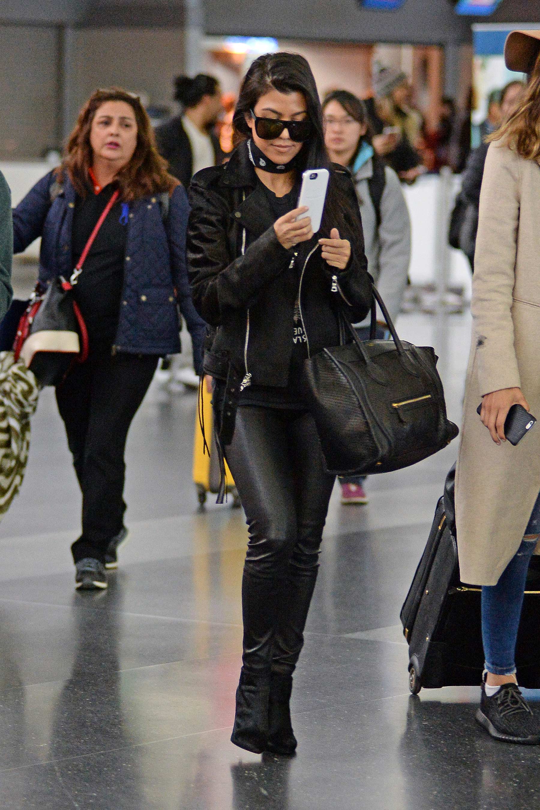 Kourtney Kardashian is seen at LAX and JFK airports