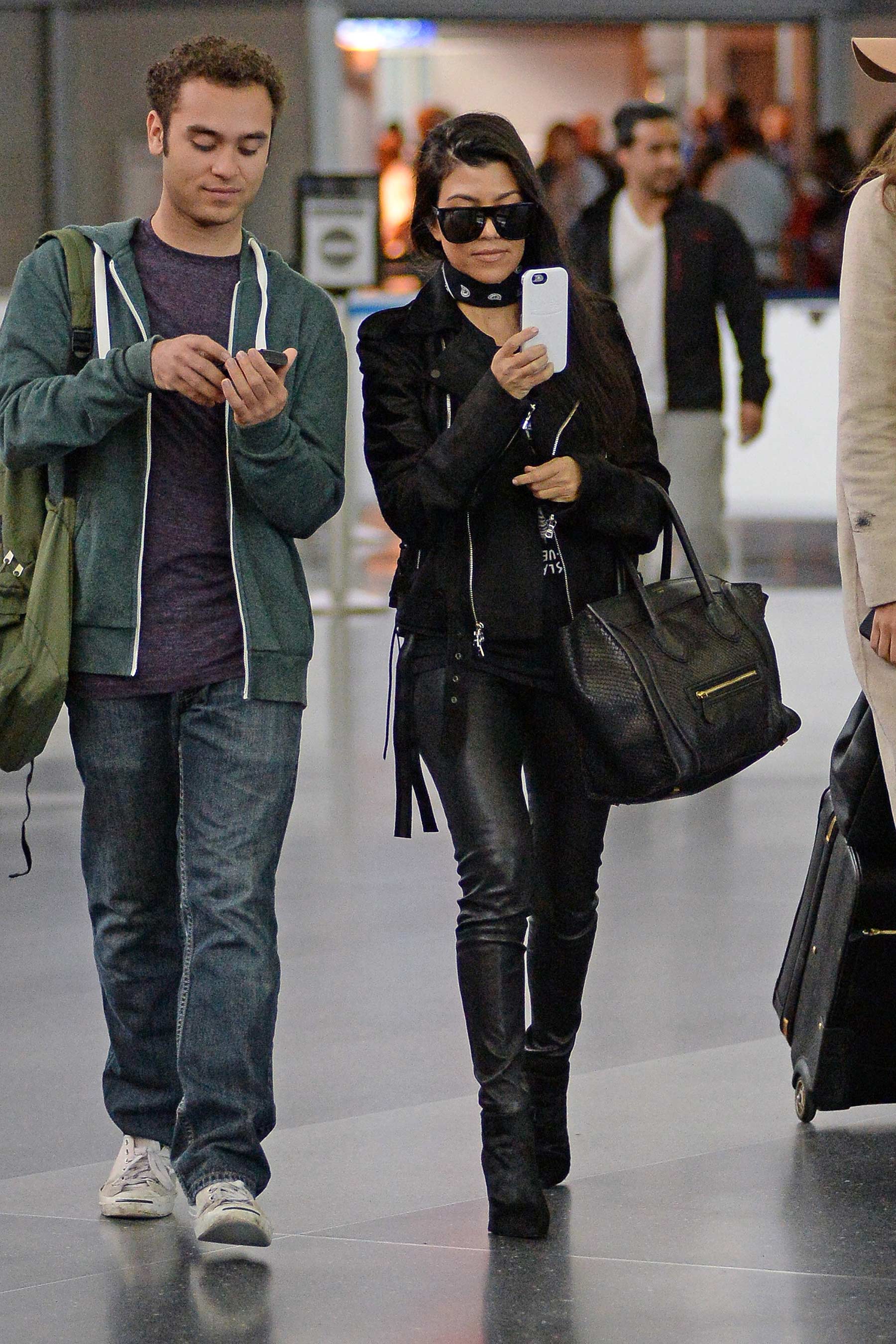 Kourtney Kardashian is seen at LAX and JFK airports