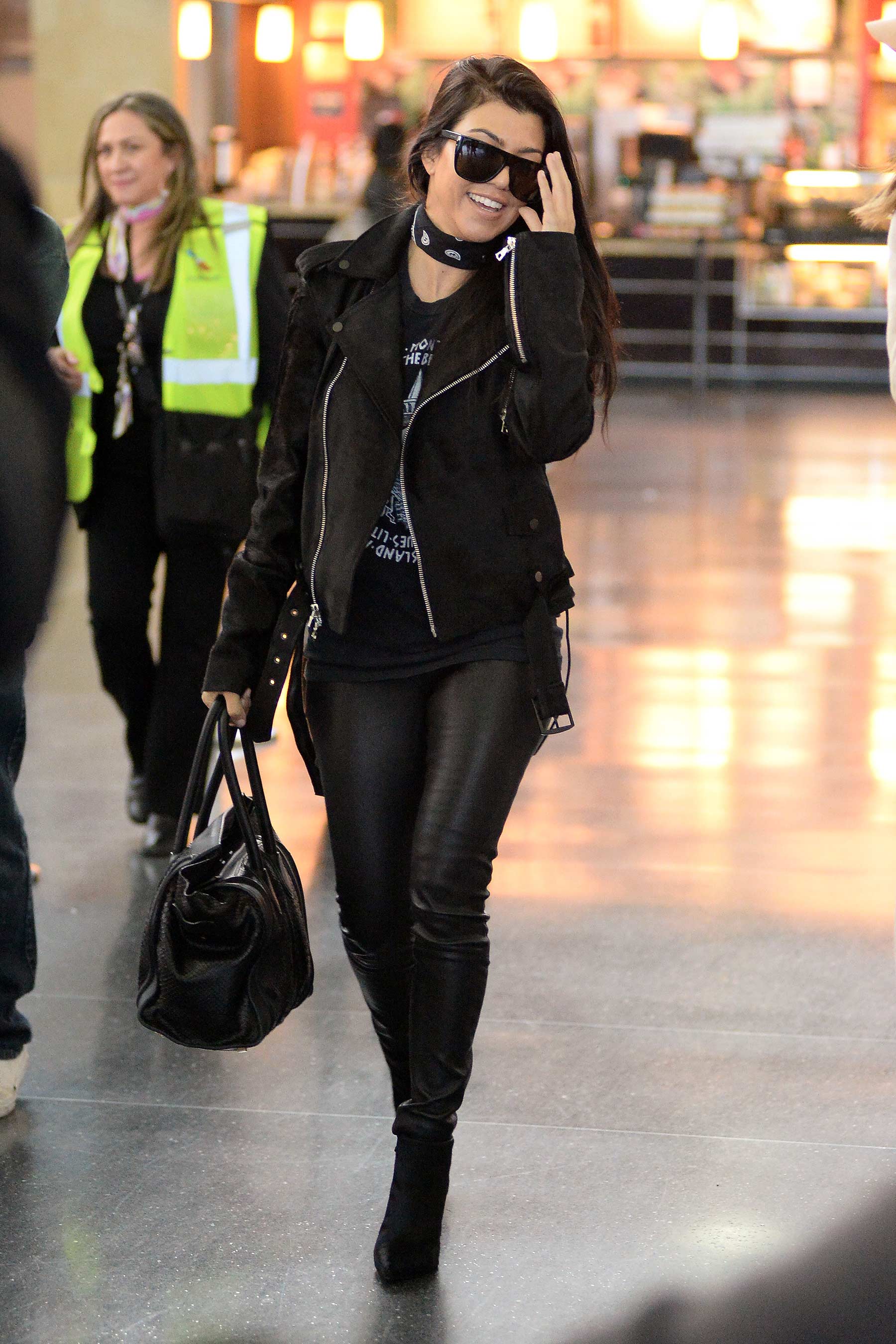 Kourtney Kardashian is seen at LAX and JFK airports