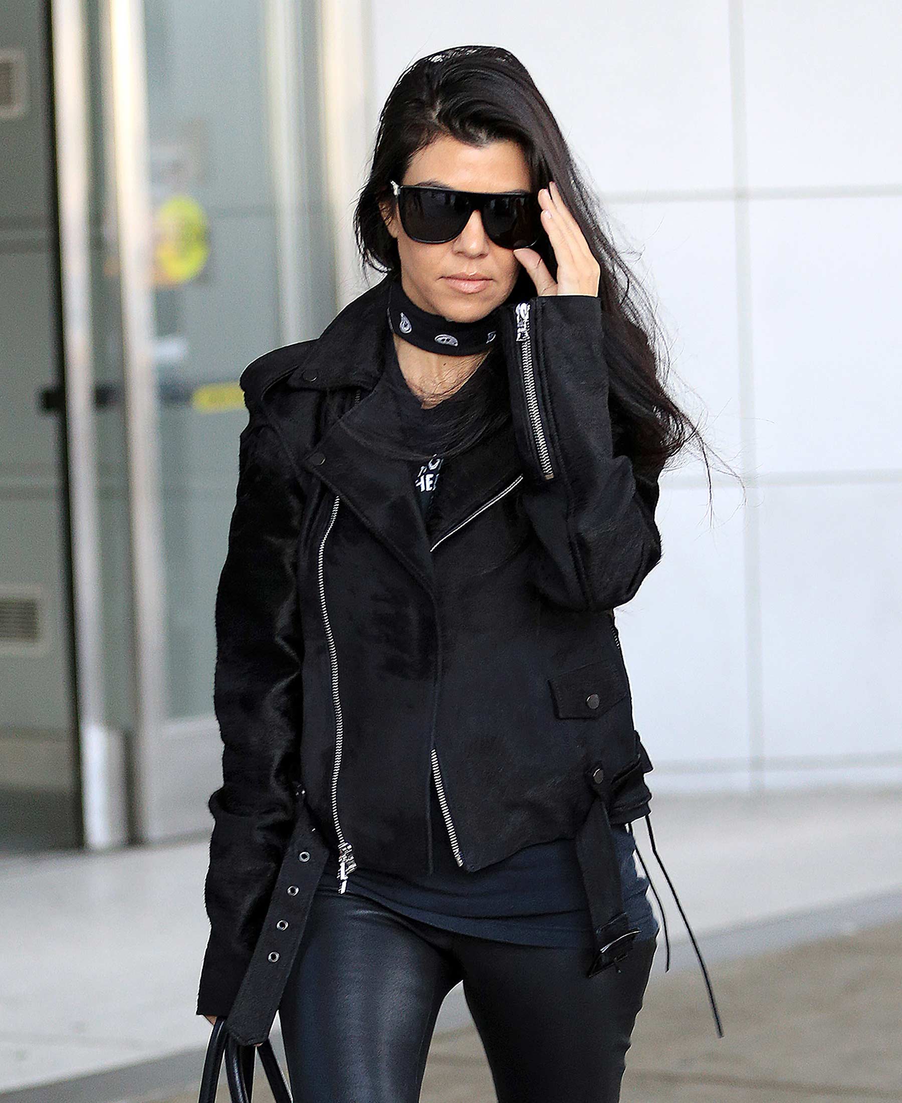 Kourtney Kardashian is seen at LAX and JFK airports