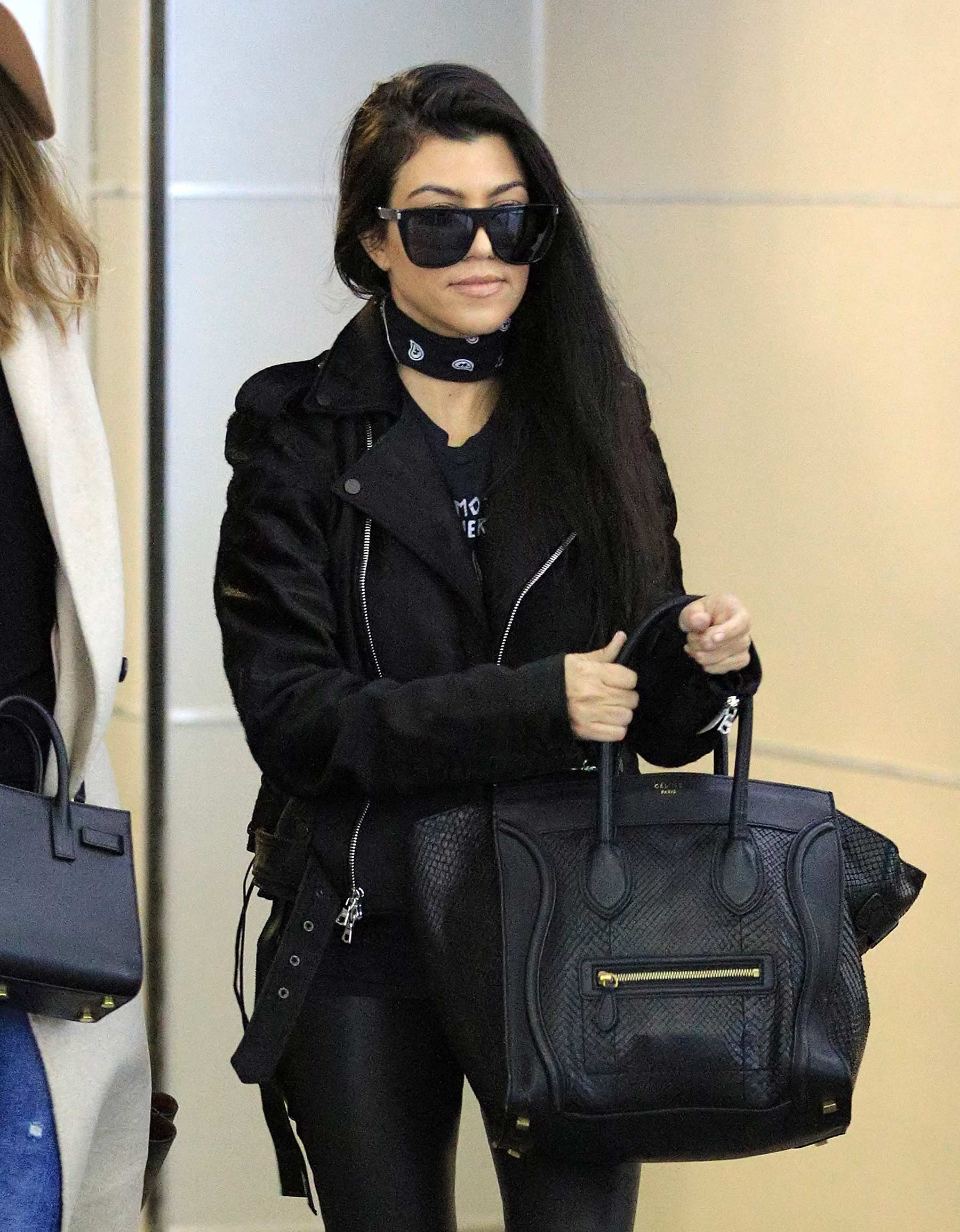 Kourtney Kardashian is seen at LAX and JFK airports